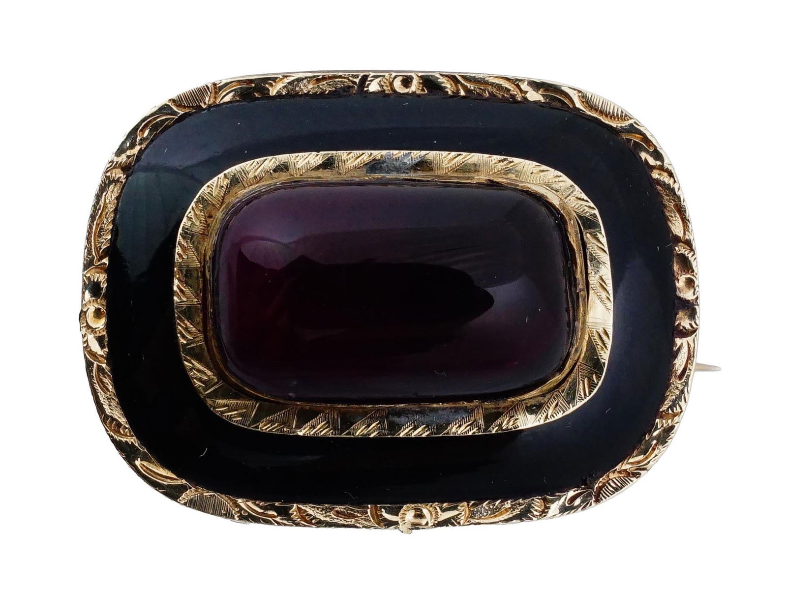 VINTAGE SILVER BROOCH WITH DEEP RED STONE: A vintage silver brooch with a stone. The brooch features a rectangular design with a deep red stone in the center. The stone is surrounded by gilt silver frames adorned with engraved foliage and geom