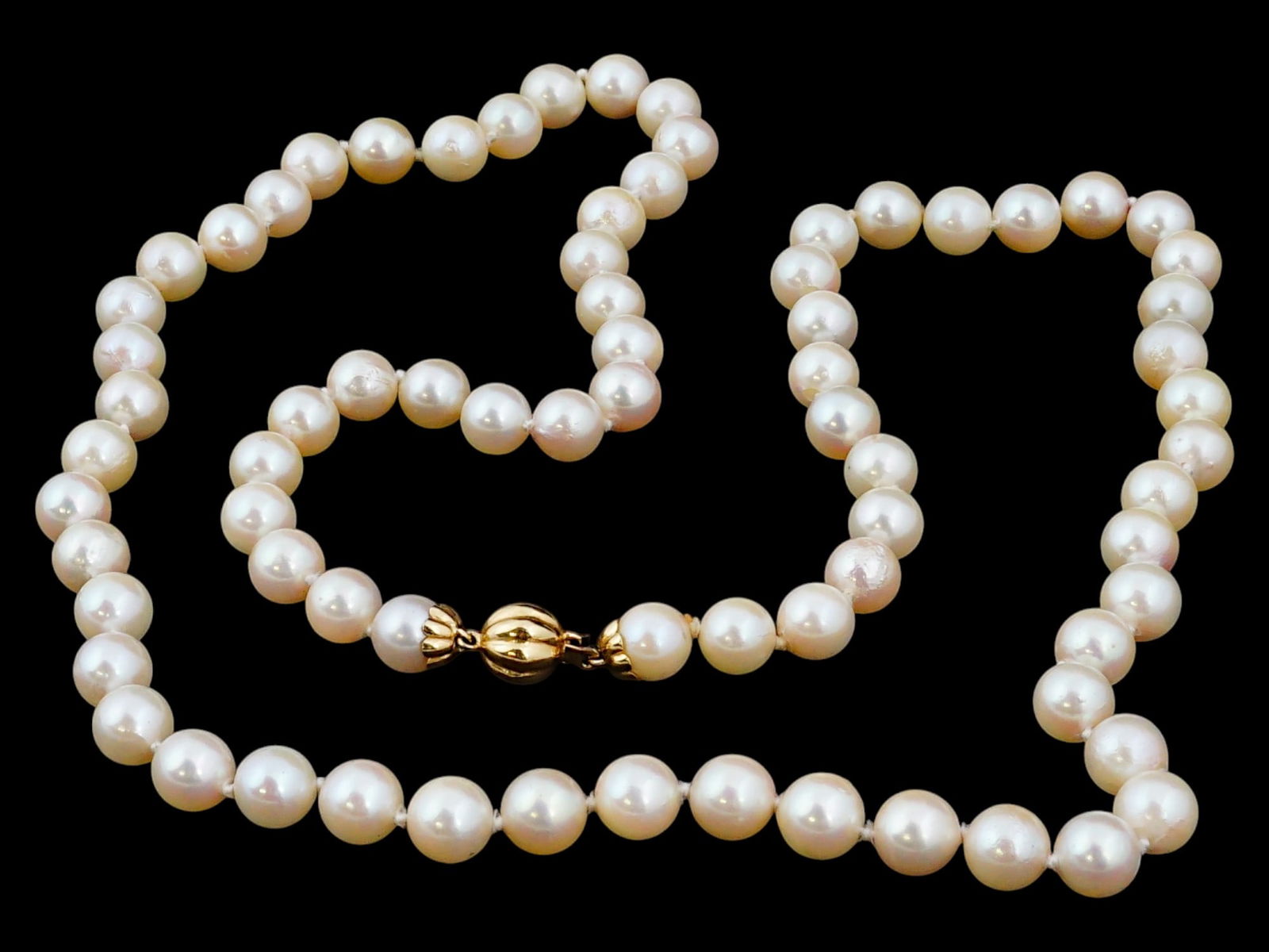 JAPANESE WHITE PEARL BEADED NECKLACE W GOLD CLASP: A Japanese beaded necklace made of white pearl beads. The necklace is adorned with a Gold clasp. Marked with an impressed mark, and a Gold standard hallmark, on the clasp. Asian and Oriental Pearl Nec