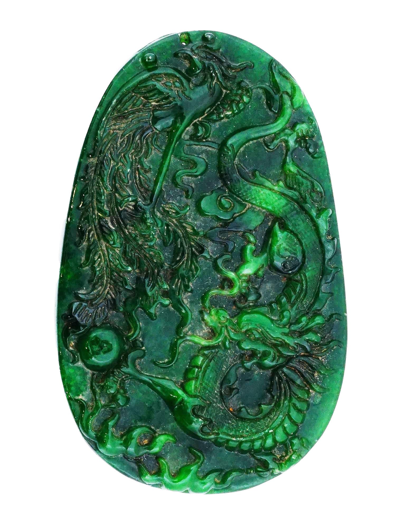 CHINESE DRAGON PHOENIX BIRD HAND CARVED JADE PENDANT: A Chinese hand carved green Jade amulet pendant. The pendant is adorned with an engraved design representing a dragon and a Phoenix bird, on the front side, and a flower on the backside. Antique and V