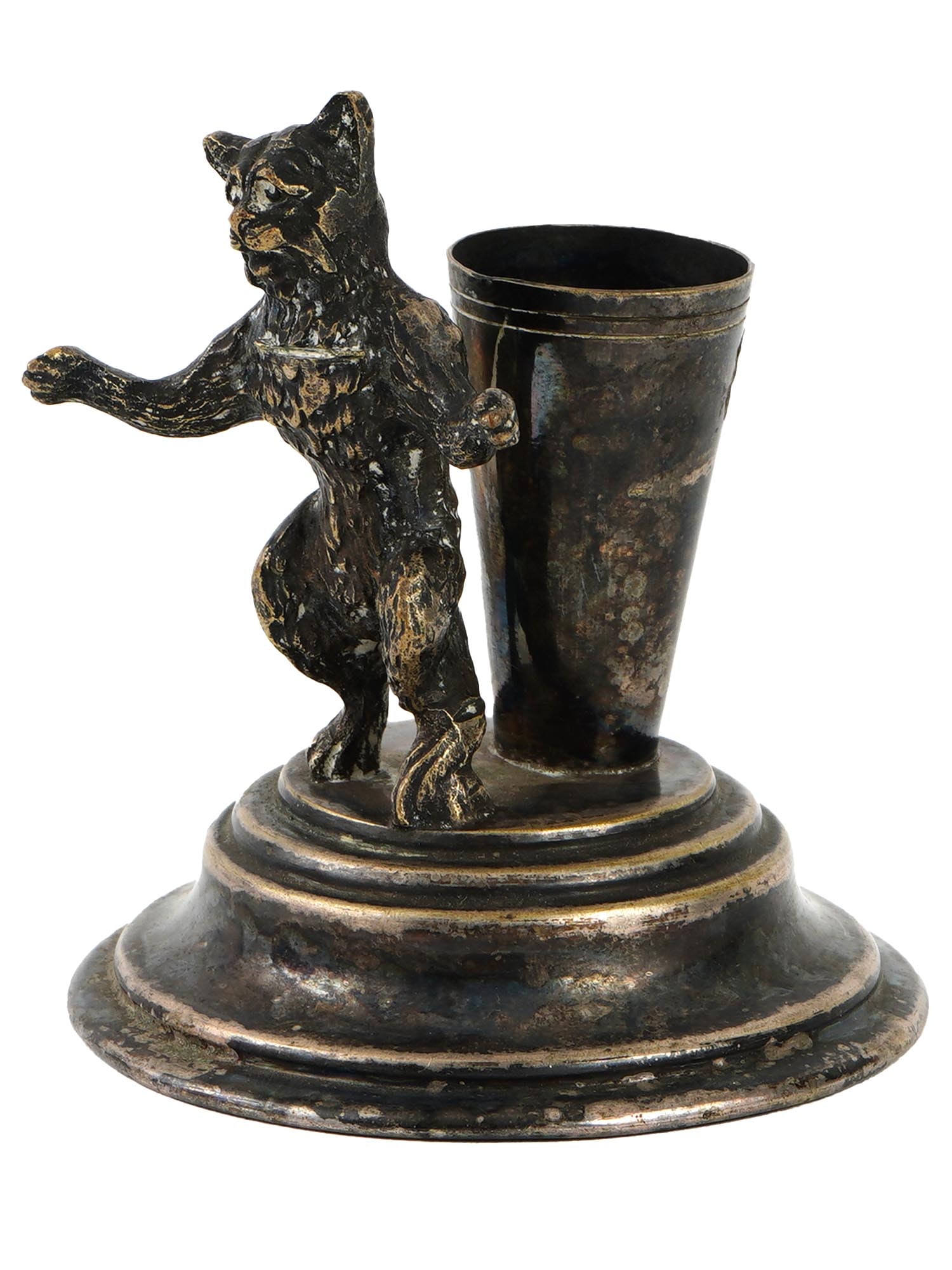 ANTIQUE SILVER TOOTHPICK HOLDER WITH CAT FIGURINE: An antique silver toothpick holder with a cat figurine. Circa the late 19th century. The conical toothpick holder sits on a stepped base, with a figurine of a cat standing on its hind legs nearby. Unm