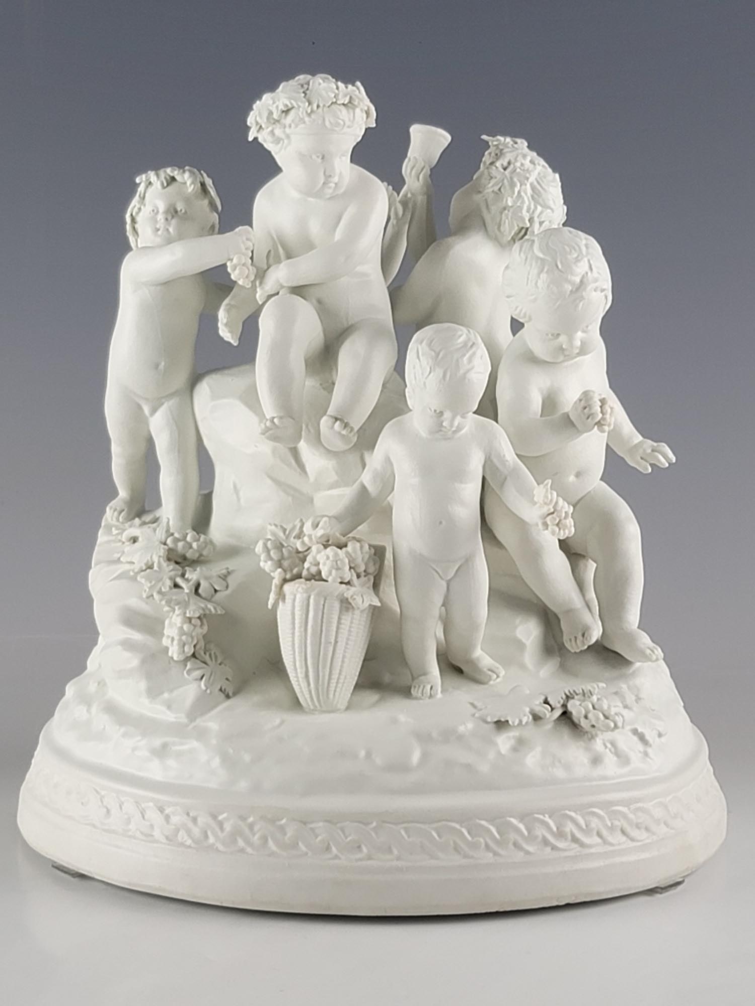 19C FRENCH SEVRES BISQUE PORCELAIN GROUP FIGURINE: A large 19th century French Sevres bisque porcelain group figurine depicting children playing with flowers. Incised with Sevres mark on the underside. Antique European Decorative Collectibles, Porcela