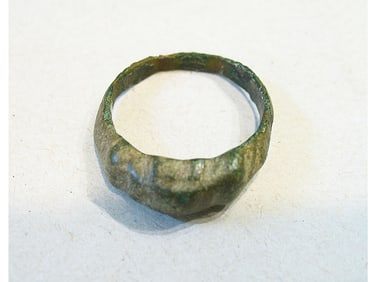 BRONZE RING WITH ENGRAVING.