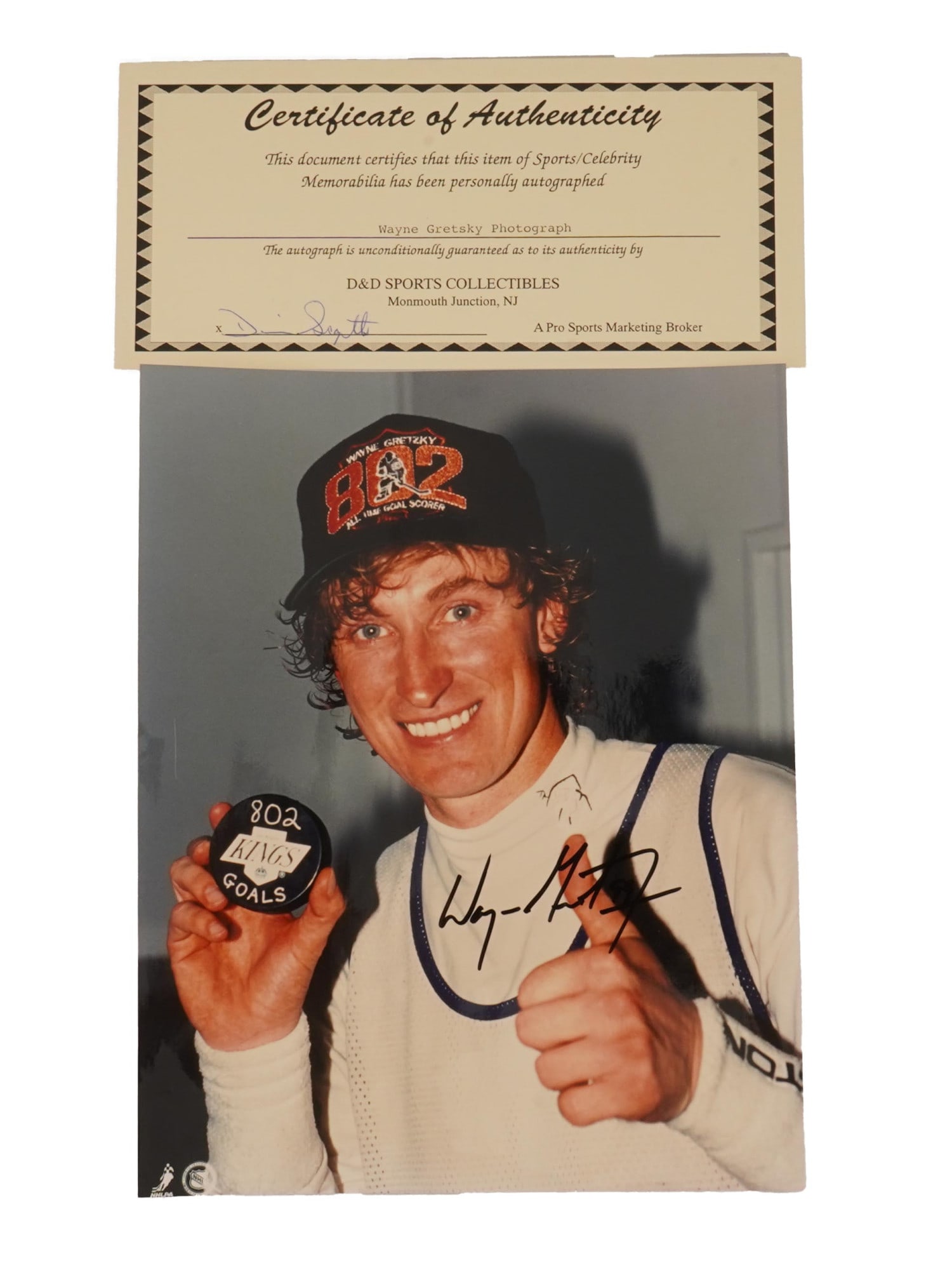 AUTOGRAPHED PHOTO OF WAYNE GRETZKYS 802ND CAREER GOAL: An autographed color photograph commemorating Wayne Gretzkys historic 802nd career goal, the moment in which he surpassed Gordie Howe to become the NHLs all-time leading goal scorer. The milestone goa