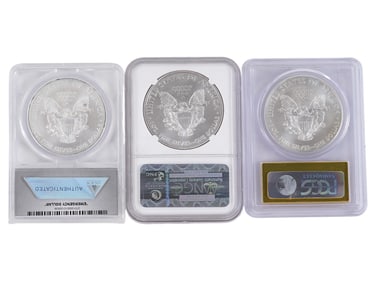THREE GRADED AMERICAN SILVER EAGLE DOLLAR COINS