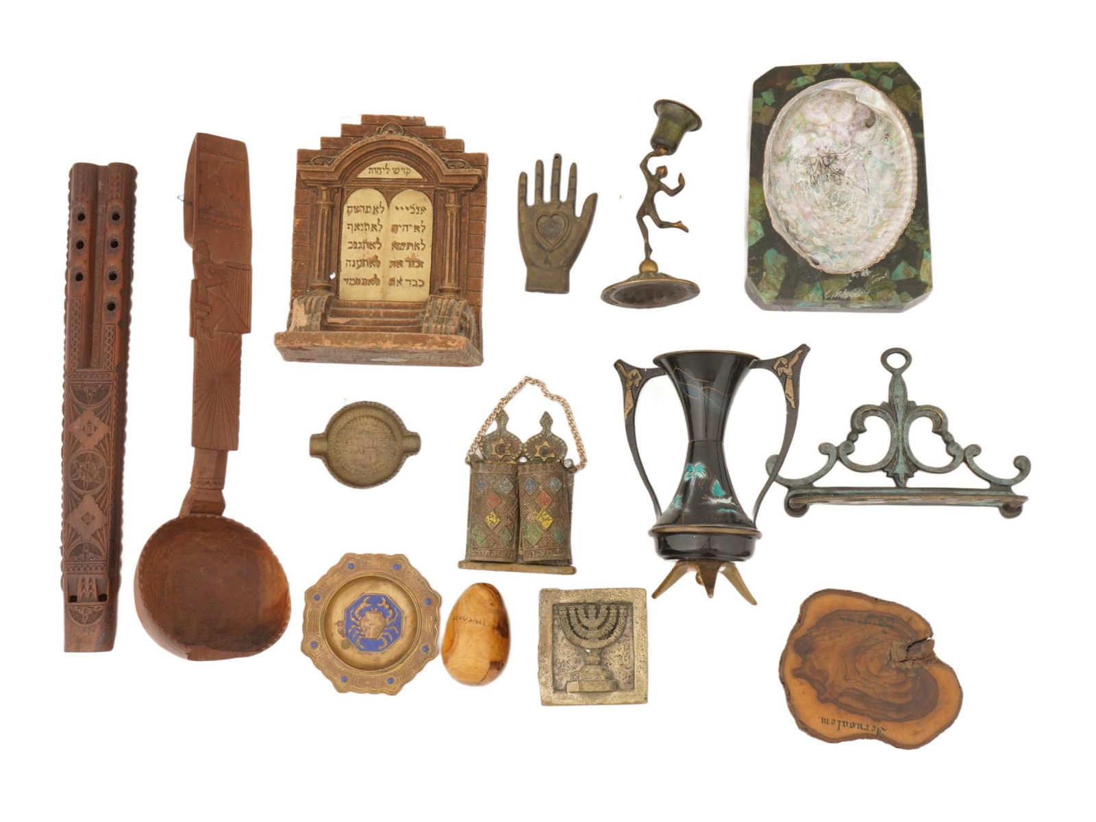 VINTAGE MISCELLANEOUS JUDAICA METAL AND WOOD ITEMS: A lot of vintage miscellaneous Judaica metal and wood items. The lot contains both religious and decorative objects, including a wooden bookend with the Ten Commandments in Hebrew, a decorative candle