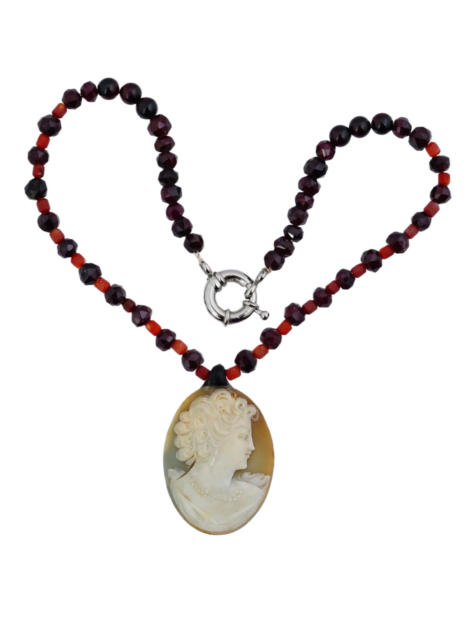 VINTAGE CAMEO NECKLACE WITH RED BEADED GEMSTONES: A vintage cameo necklace accented with red beaded gemstones. The beads are strung on wire or cord and meet at the front with a modern-style toggle clasp. Beaded Necklaces And Jewelry Collectibles.