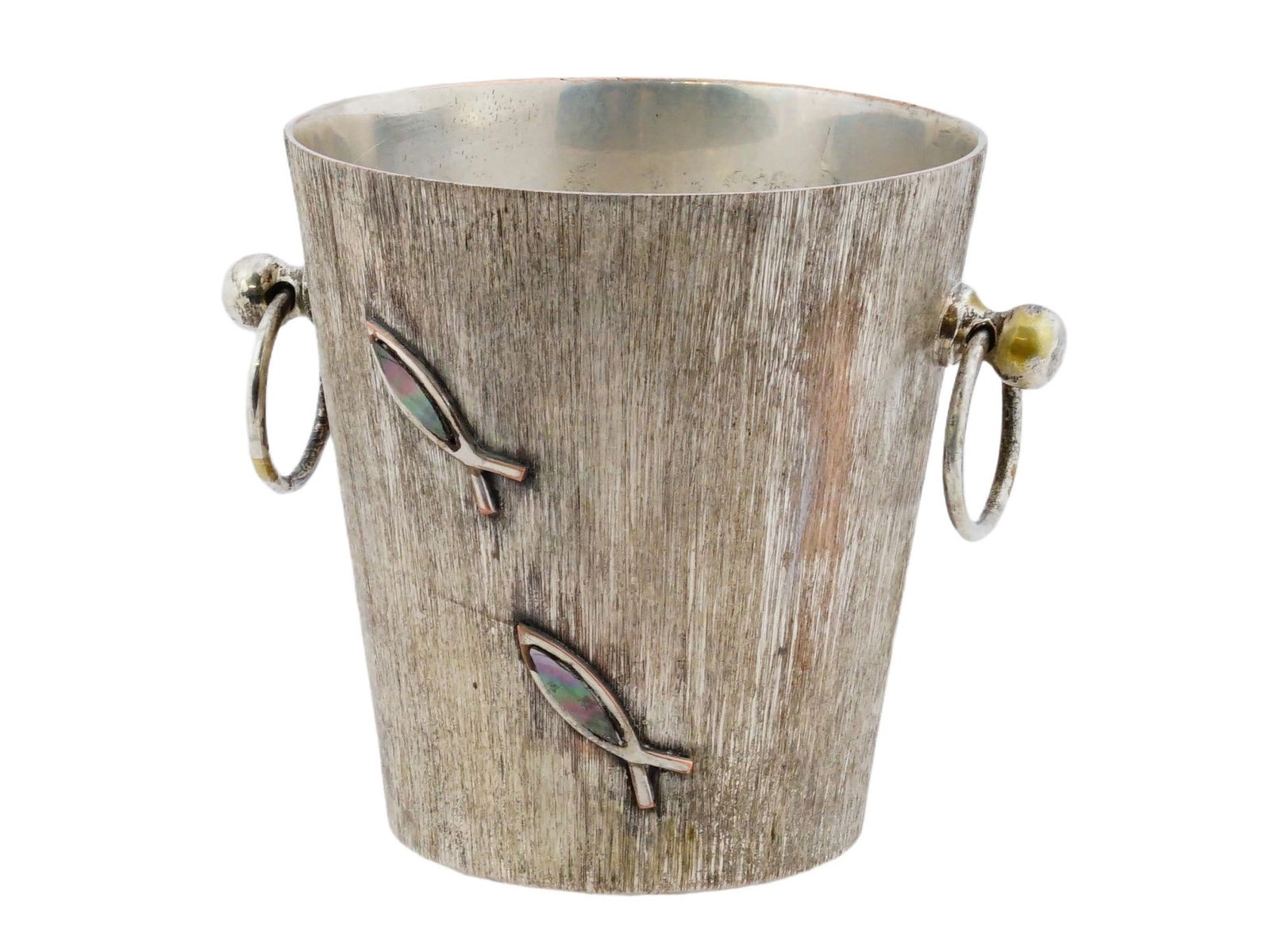 VINTAGE LOS CASTILLO SILVER PLATED ICE BUCKET: A vintage Los Castillo silver plated ice bucket. Circa mid 20th century, 1950s to 1960s. The two-handled bucket features a textured surface decorated with stylized fish appliques. The bottom is marked