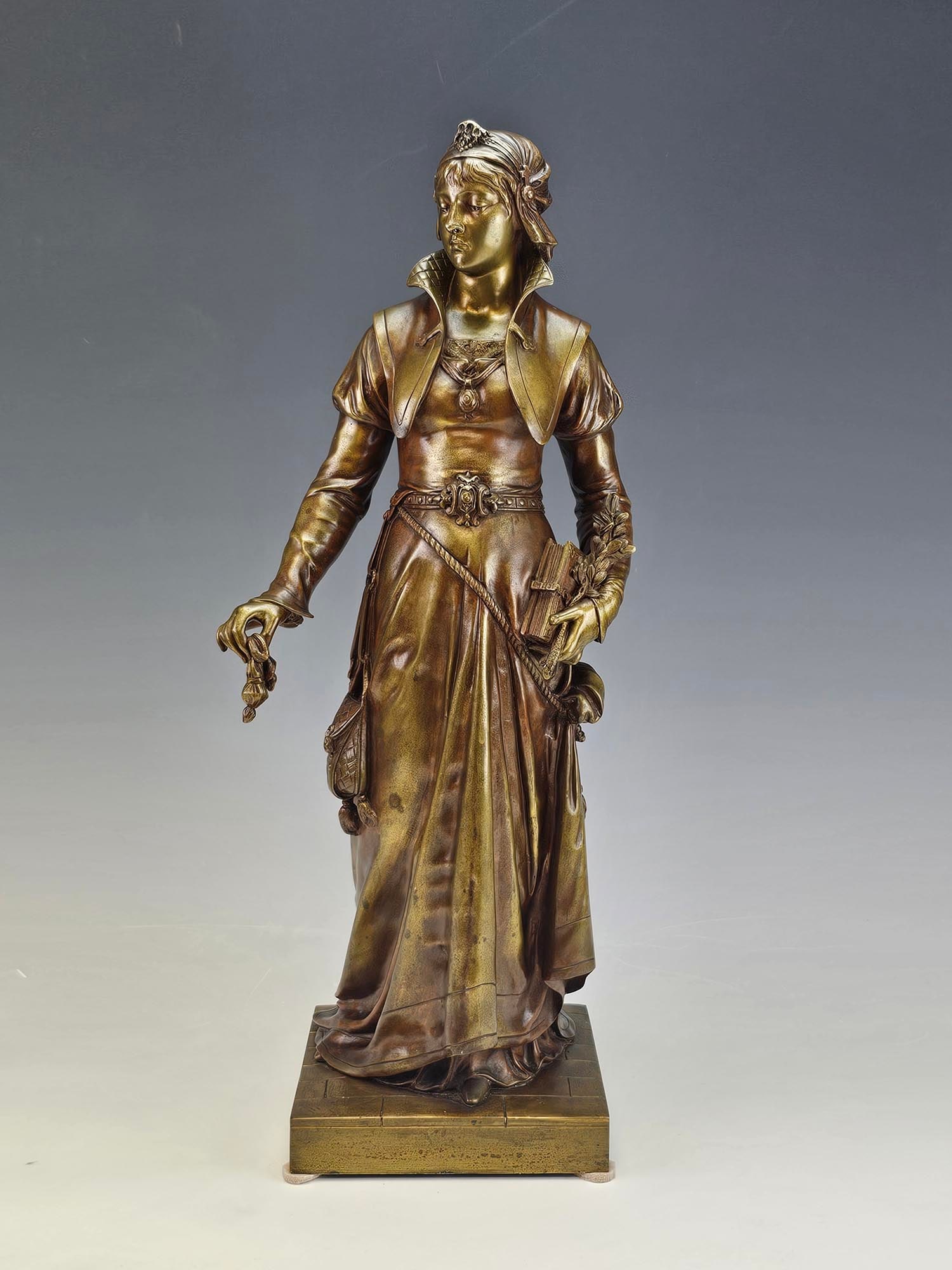 FRENCH BRONZE SCULPTURE BY JEAN LOUIS GREGOIRE CHARITY: An antique French bronze sculpture titled La Charite, The Charity, by Jean-Louis Gregoire, 1840 to 1890, noted for his bronze and marble sculptures and figures. The work depicts a young woman rendered