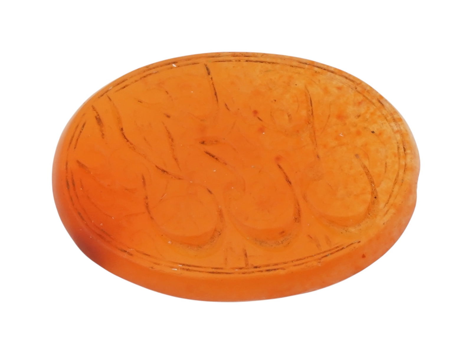 ANTIQUE ISLAMIC CARNELAIN INTAGLIO SEAL: An antique late 19th-century carnelain intaglio seal. Oval shape. The intaglio depicts Arabic calligraphy. Islamic Collectibles, Mineral Stone Carvings, Stamps And Seals. THIS LOT IS ELIGIBLE F
