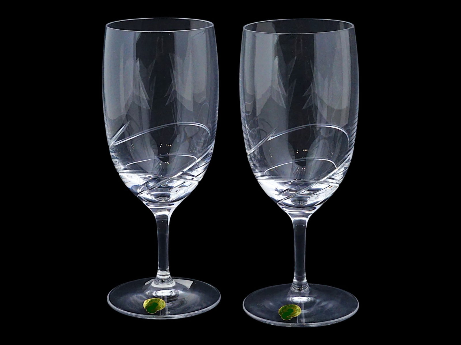 PAIR OF WATERFORD BALLET RIBBON CHAMPAGNE GLASSES IOB: A pair of Ballet Ribbon Essence champagne flutes glasses by Waterford Crystal. Crafted from crystal, they feature a contemporary design with a delicate engraving of a single ribbon, reminiscent of the
