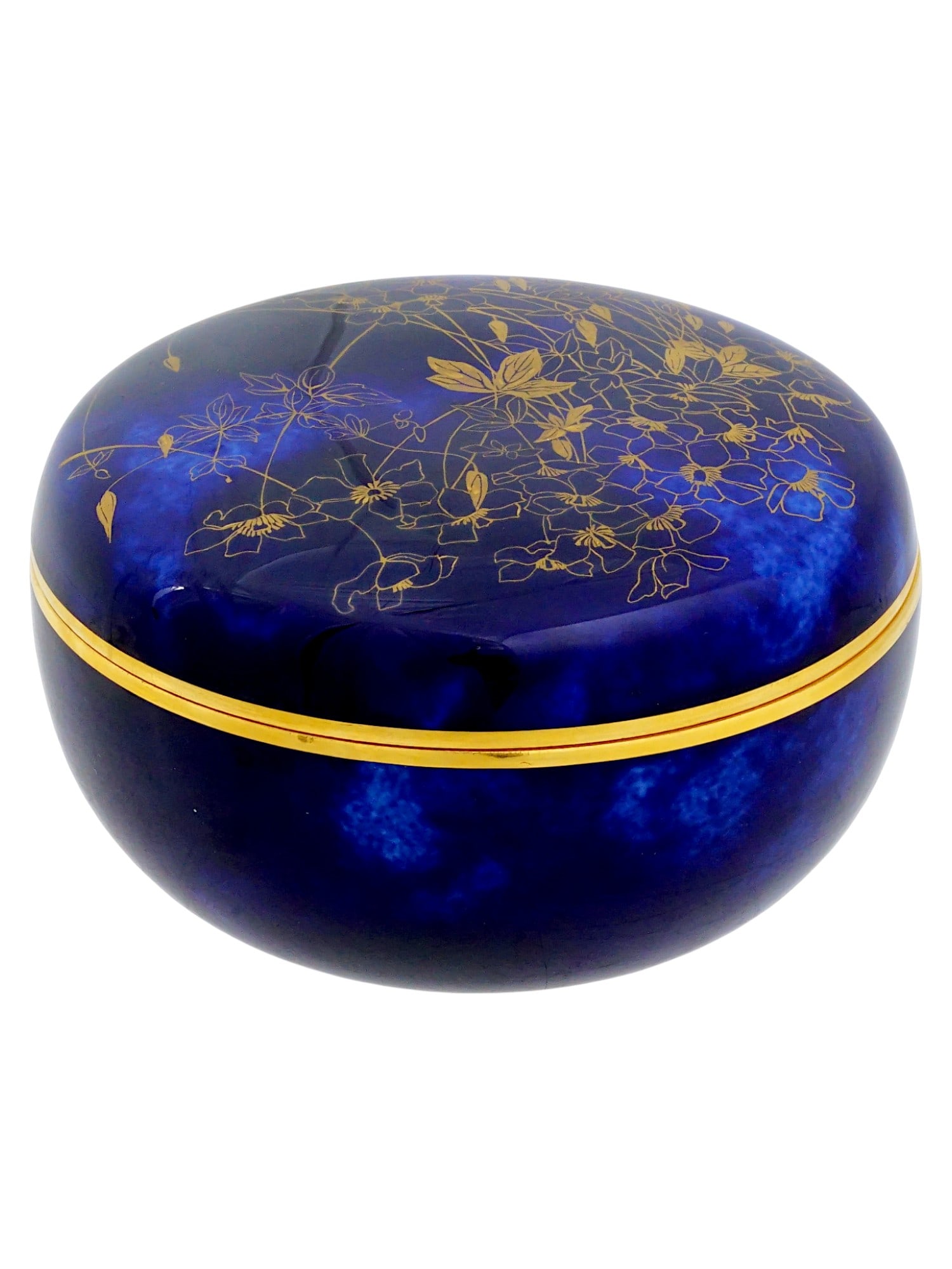 ANTIQUE FRENCH SEVRES PORCELAIN TRINKET BOX: An antique late 19th-century French porcelain lidded trinket box. Round shape. Cobalt blue ground with gilt rims and floral ornaments. The white interior is also garnished with gilt flowers. Sevres do