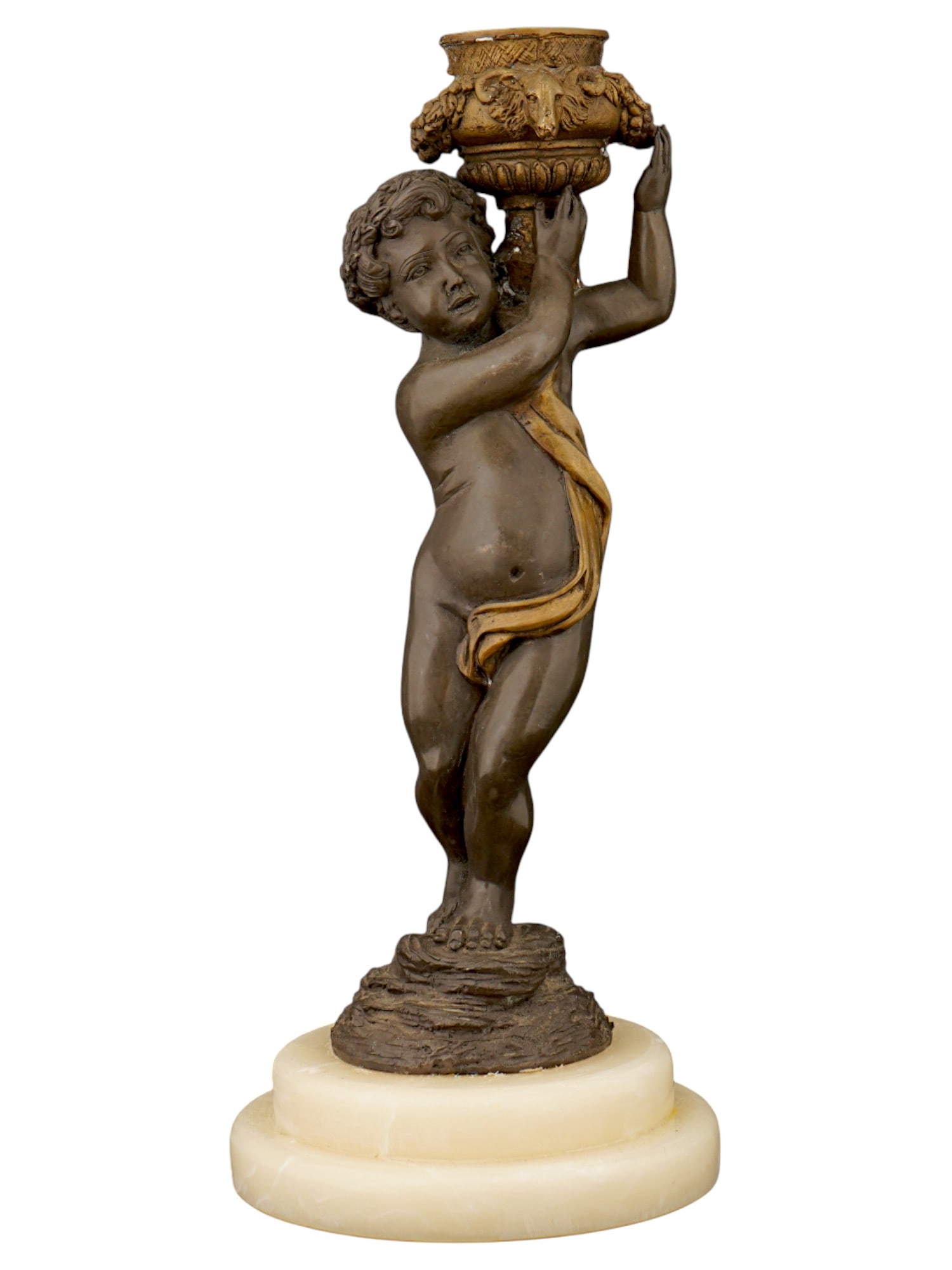 ANTIQUE BRONZE FIGURAL PUTTO CANDLE HOLDER W STONE BASE: An antique figural candle holder featuring a patinated bronze putto standing on a stone base. The figure is holding a gilt top portion, which serves as the candle socket. Antique and Vintage Candle Ho