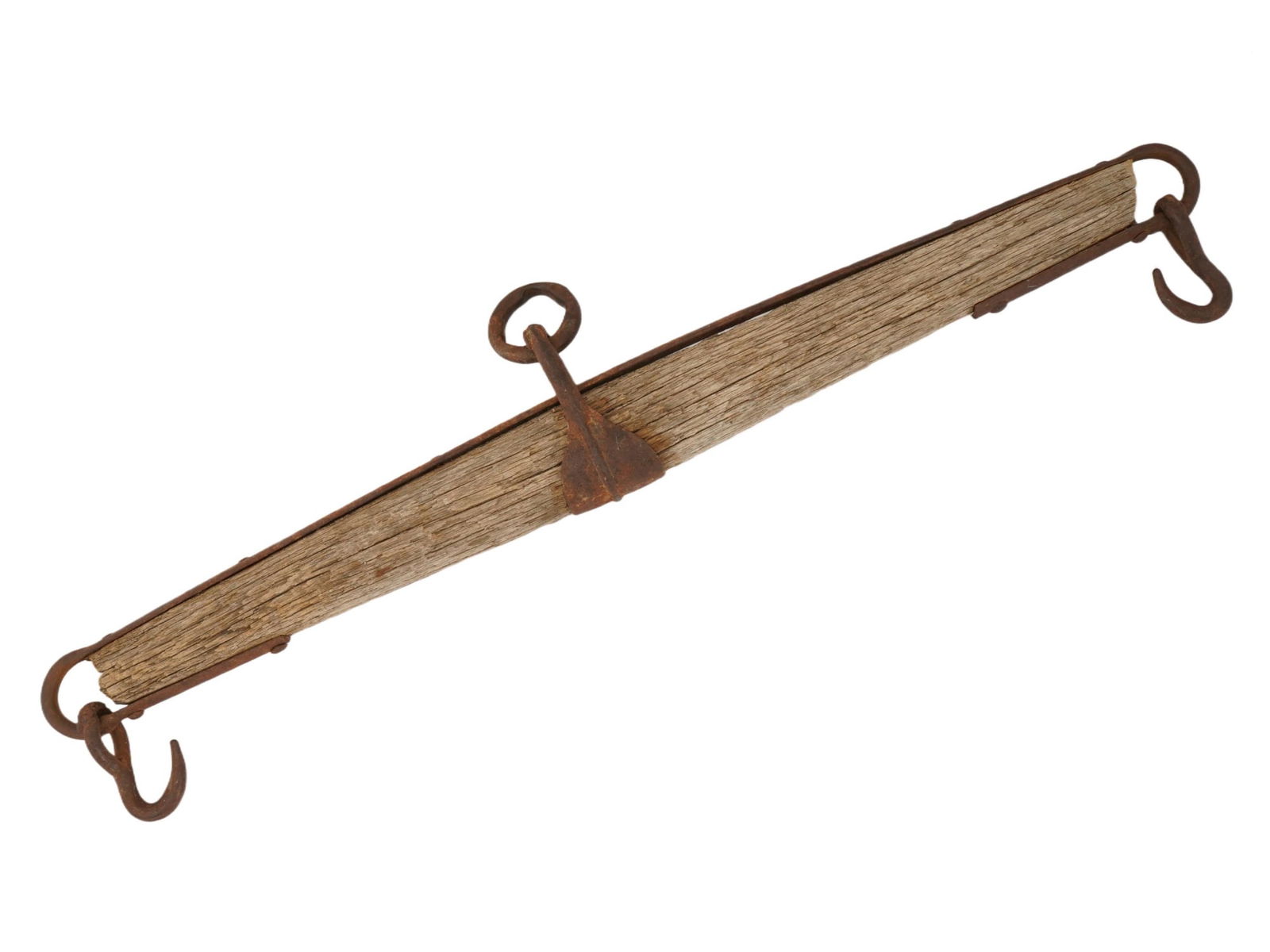 ANTIQUE SINGLETREE FOR HORSE OR OX DRAWN FARM HARNESS: An antique singletree, used as part of a horse- or ox-drawn farm harness. This wooden beam with iron fittings functioned as an evener, distributing the pulling force of one or more animals to a plow,