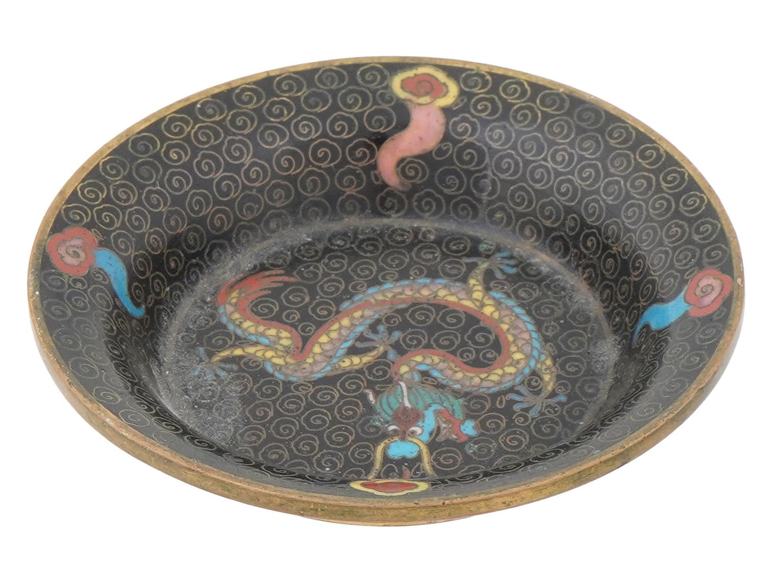ANTIQUE CHINESE QING CLOISONNE ENAMEL BRASS SAUCER: An antique Chinese Qing dynasty cloisonne enamel brass saucer. The saucer is adorned with a swirl pattern and a dragon over a black ground. Turquoise blue bottom. Antique and Vintage Asian and Orienta