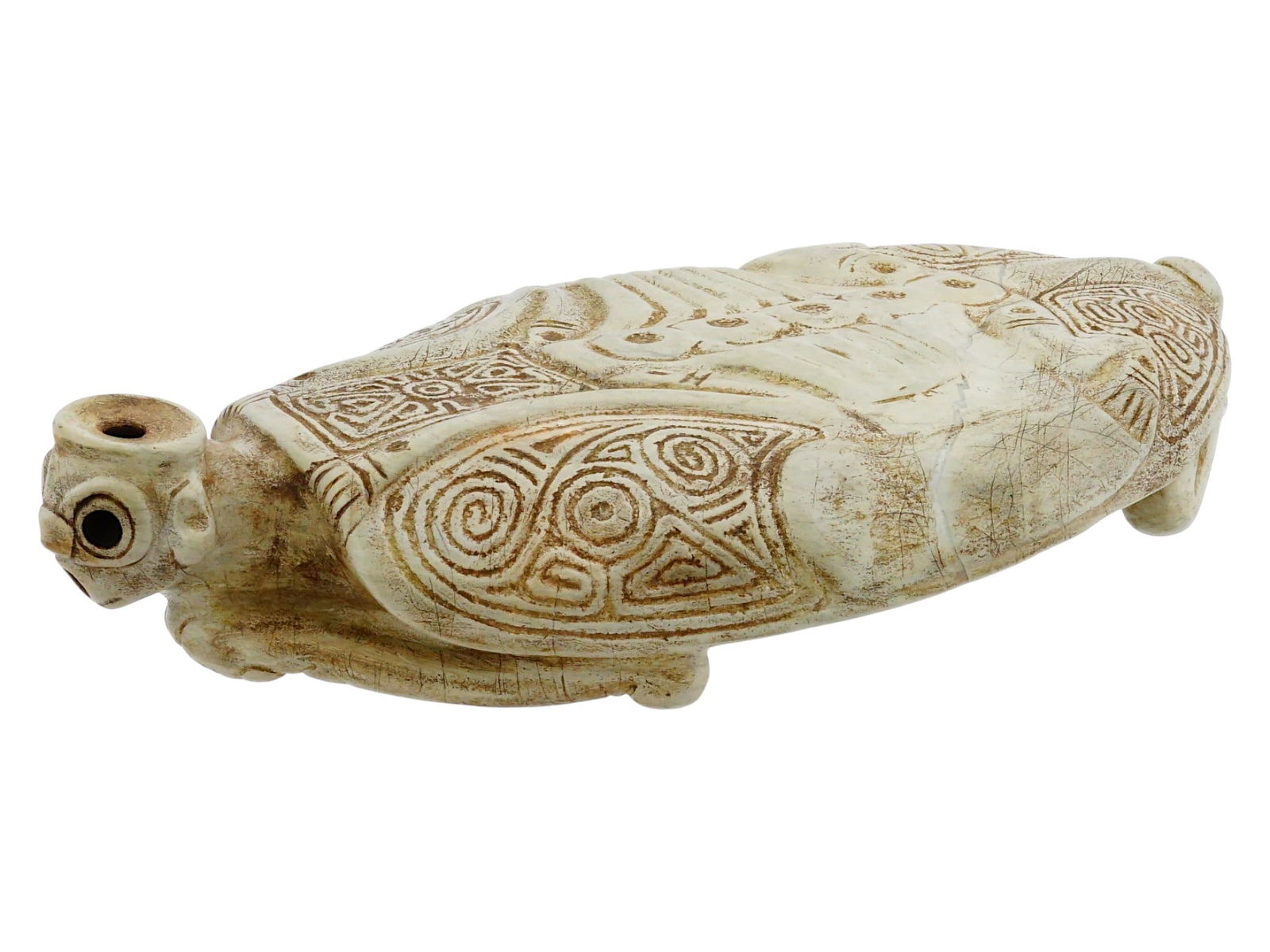 ANCIENT PRE COLUMBIAN TAINO STONE ZEMI FIGURINE: An ancient Mesoamerican hand-carved hardstone sculpture, Zemi. Taino culture. A semi-anthropomorfic flat figure with frog features and abstract ghost face. Elaborately carved ornaments. Pre Columbian