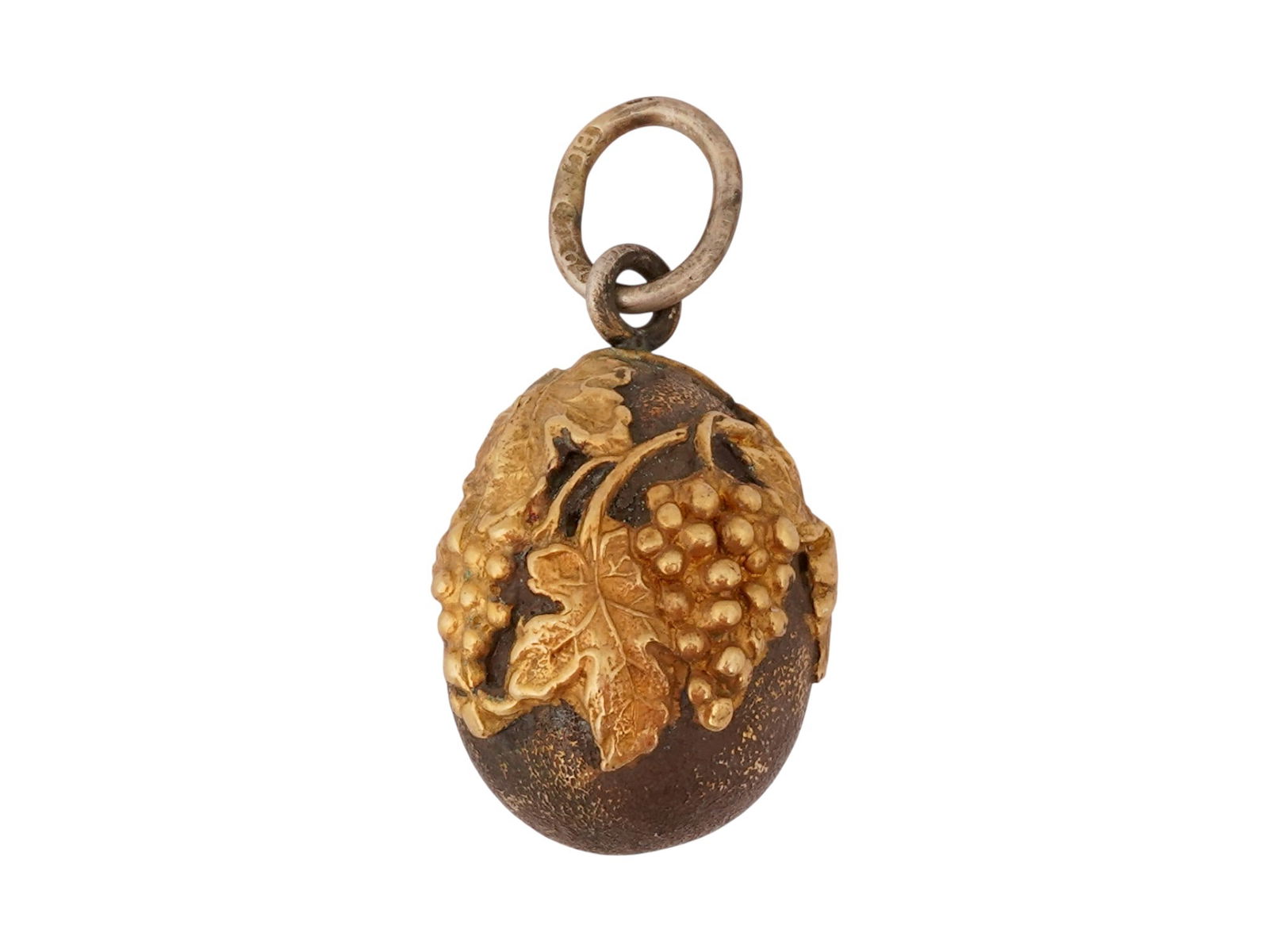 RUSSIAN GILT SILVER GRAPE EASTER EGG PENDANT: A Russian gilt silver Easter egg pendant featuring an overlay decoration of grape bunches and leaves. The piece is hallmarked with the 84 Russian silver standard and makers marks on the fitting ring.