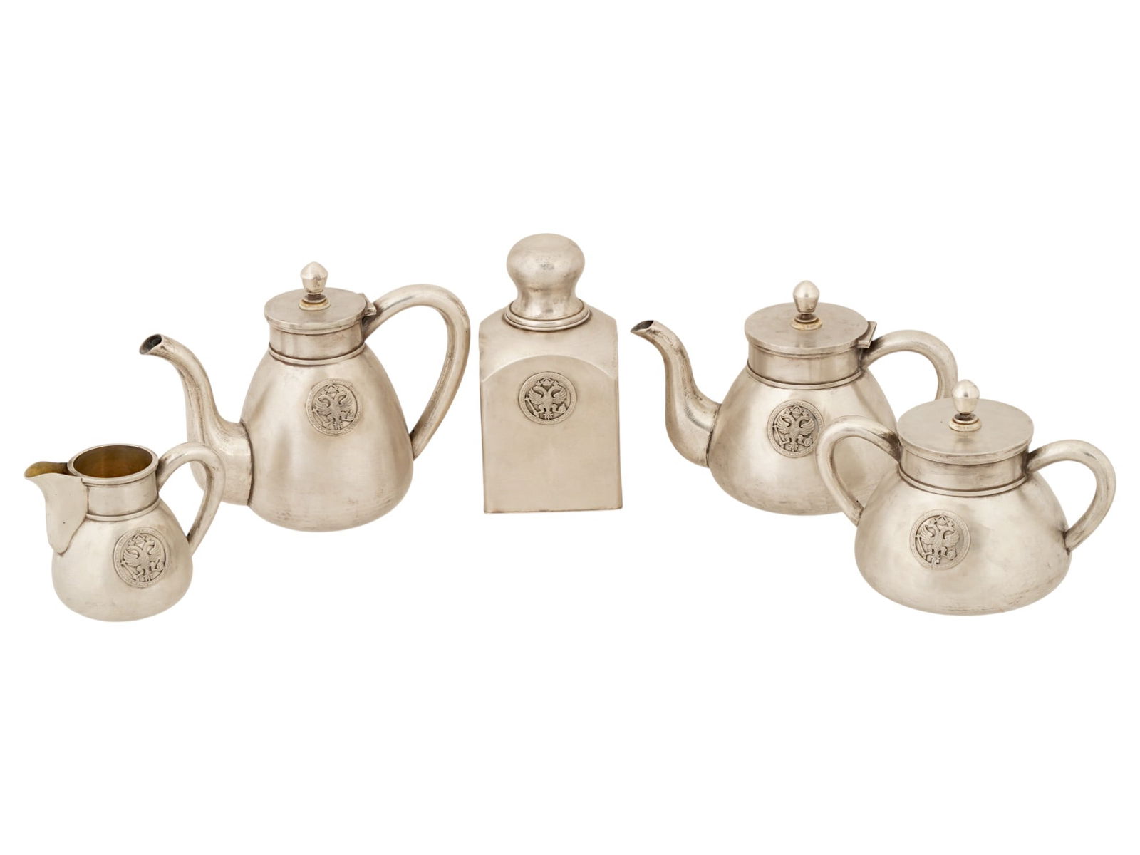 RUSSIAN SILVER IMPERIAL PRESENTATION 5 PIECES TEA SET: A heavy Russian Imperial Presentation Silver tea or coffee set consisting of five pieces, two teapots coffee pots, a milk jug, a sugar bowl, and a tea or biscuits jar. The pieces have a smooth surface