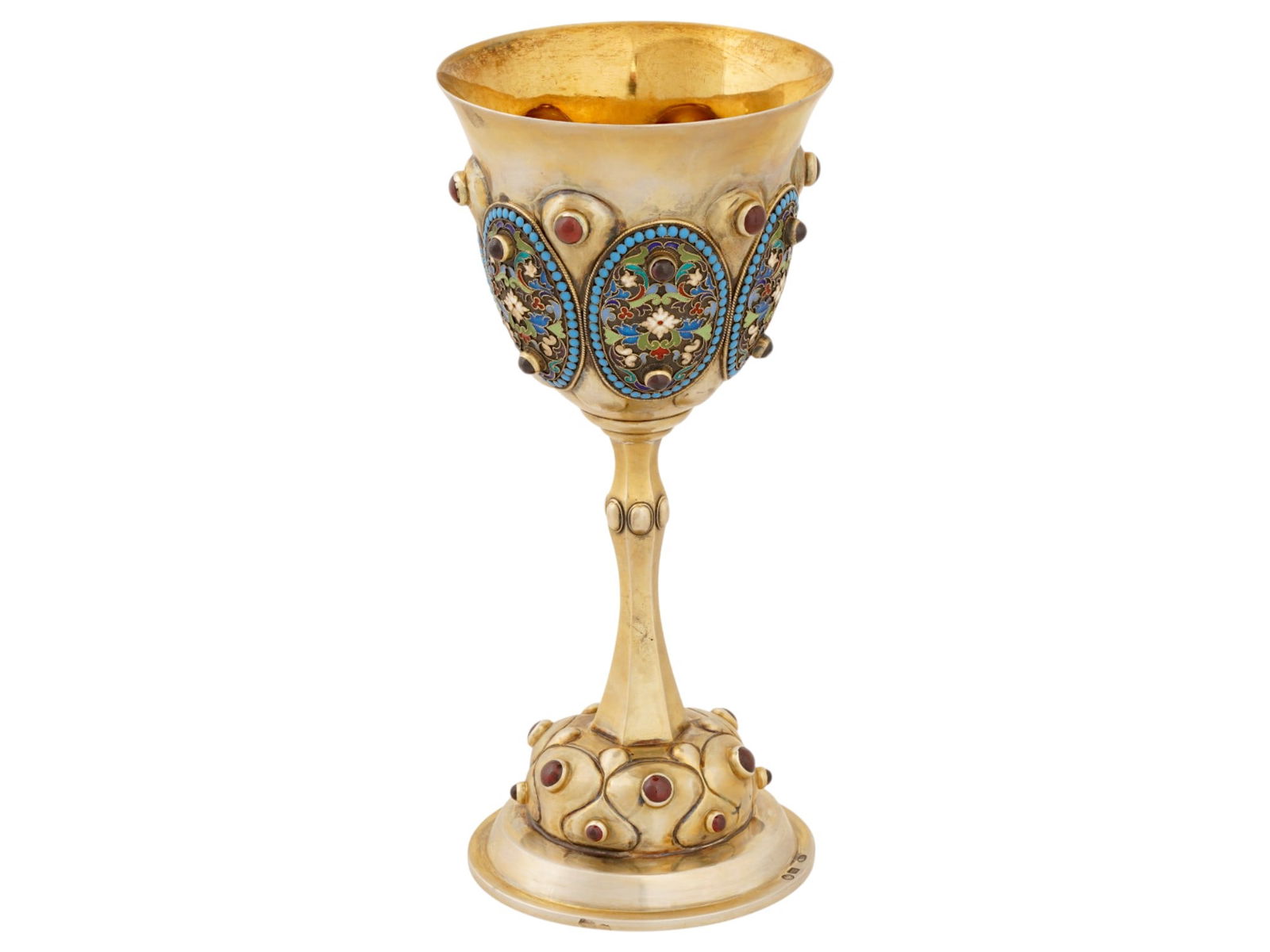 RUSSIAN JUDAICA SILVER ENAMEL KIDDUSH CUP W GEMSTONES: A Russian Judaica gilt silver enamel kiddush cup. The cup is adorned with oval shaped medallions, covered with polychrome floral, foliage, and geometrical patterns made in the cloisonne technique, enc