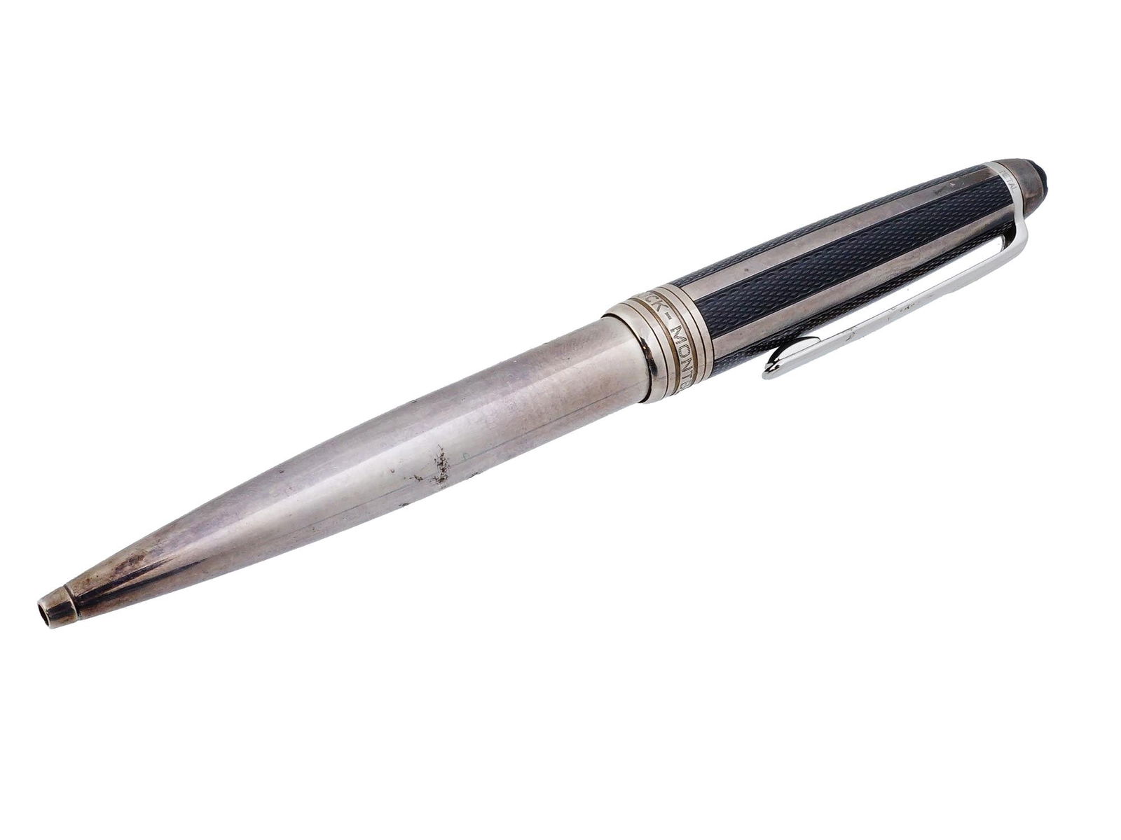 MONTBLANC MEISTERSTUCK STERLING BALLPOINT PEN: A vintage ballpoint pen by Montblanc, Meisterstuck collection. Sterling silver body and a cap with a net pattern. The cap is surmounted by the white star emblem. Hallmarked with Montblanc Meisterstuck