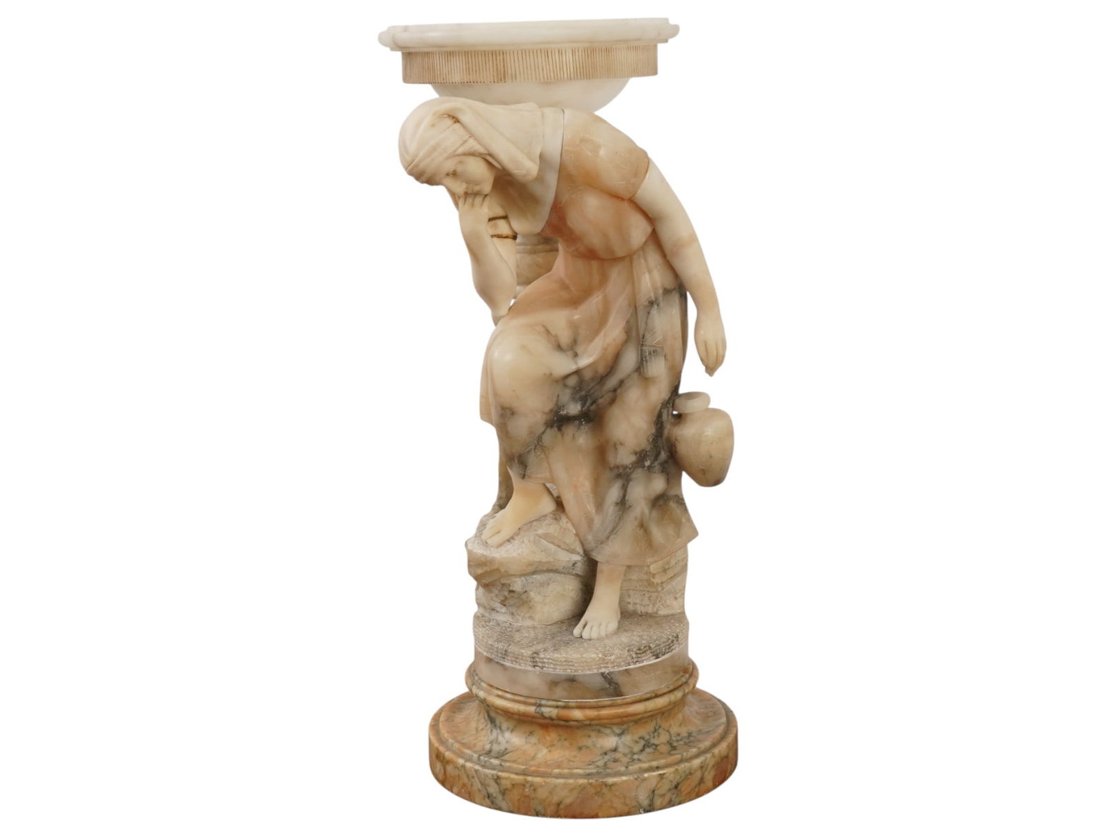 ITALIAN CARVED MARBLE SCULPTURE OF REBECCA AT THE WELL: An Italian sculpture hand carved of marble, depicting the biblical figure of Rebecca at the Well. Adorned with subtle engraved patterns. Presumably used as a lamp. Likely signed on the base. European
