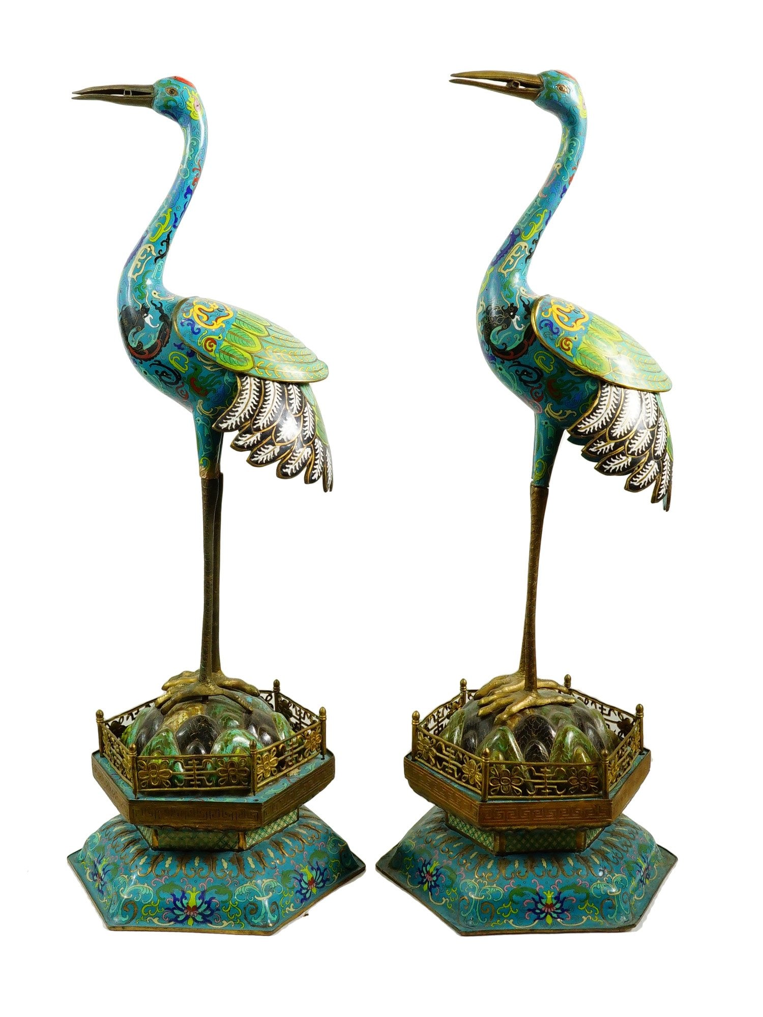 CHINESE QING CLOISONNE ENAMEL CRANE FIGURINES 19TH C: A pair of large antique Chinese cloisonne enamel crane figurines with long necks and legs, Qing Dynasty, 19th century. The bodies of the cranes and their bases are decorated with foliage patterns and