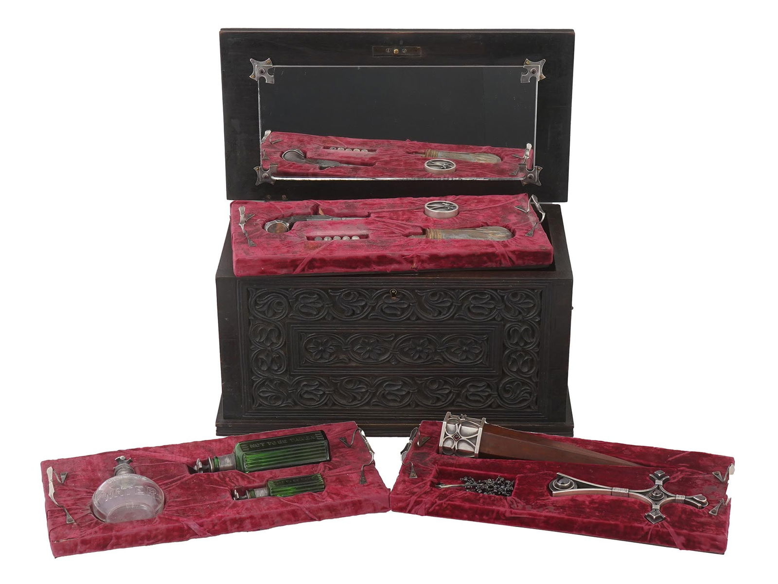 ANTIQUE 19TH C VAMPIRE KILLING KIT WITH GEM INLAY AND SILVER: An antique 19th-century vampire killing kit. Carved oak wood box with key-lockable hinged lid. Ornate exterior, silver overlay inscription in Latin "Deus Vult", which translates to "God's Will" on the