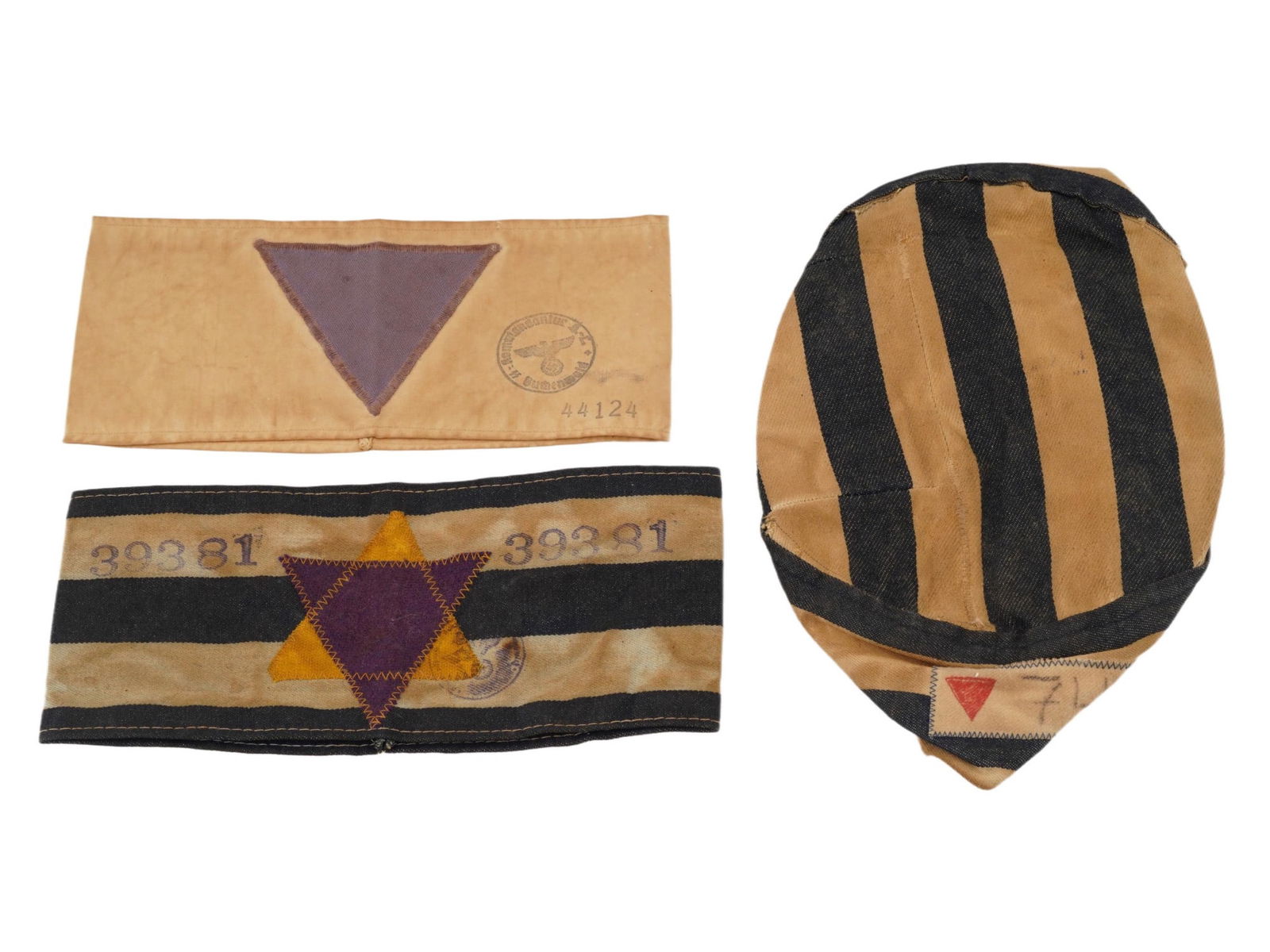WWII NAZI GERMAN CONCENTRATION CAMP PRISONER ITEMS: A group of three World War II era Nazi German concentration camp prisoner items. These cloth identifiers were forcibly worn by individuals in concentration camps and ghettos to mark them according to