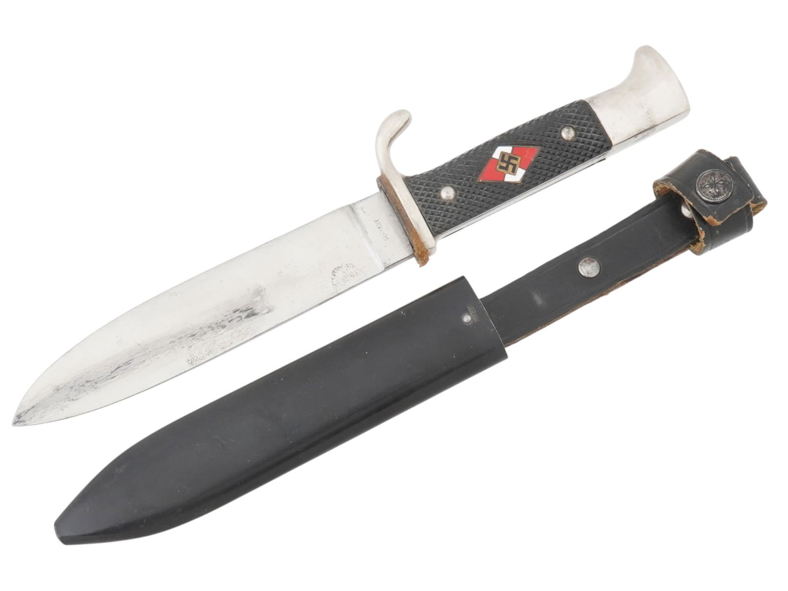 WWII NAZI GERMAN HITLER YOUTH DAGGER W SCABBARD: WWII German Third Reich Hitler Youth member dagger with a black painted magnetic sheet steel scabbard. The black bakelite grip has an enameled diamond with a swastika inlay. Engraved Germany and numbe