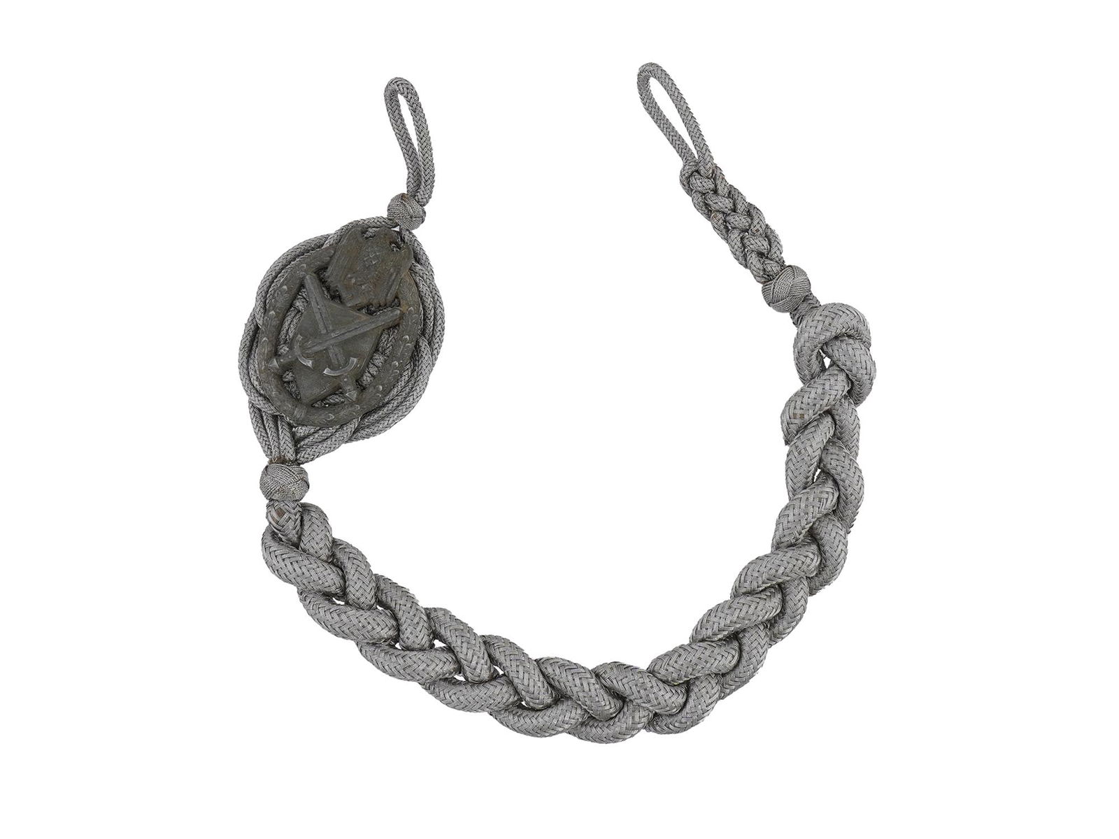 GERMAN WWII SCHUTZENSCHNUR MARKSMAN CORD F ARTILLERYMEN: A German WWII ceremonial Schutzenschnur, marksman cord for excellent shooting for Artillerymen. The tightly woven cord of silver tone with a badge modeled in the shape of a wreath, in the center of wh