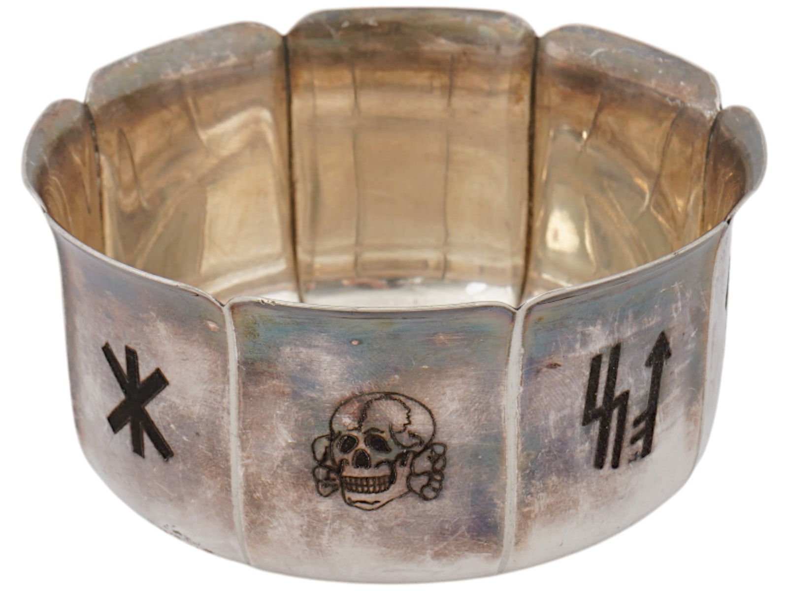 GERMAN WWII TOTENKOPF RUNES SILVER BOWL: A World War II type Nazi German silver bowl. Faceted piece with figurative rim. Each facet features a niello symbol, Totenkopf and Germanic runes. Marked Wellner on the bottom. Wellner is a German sil