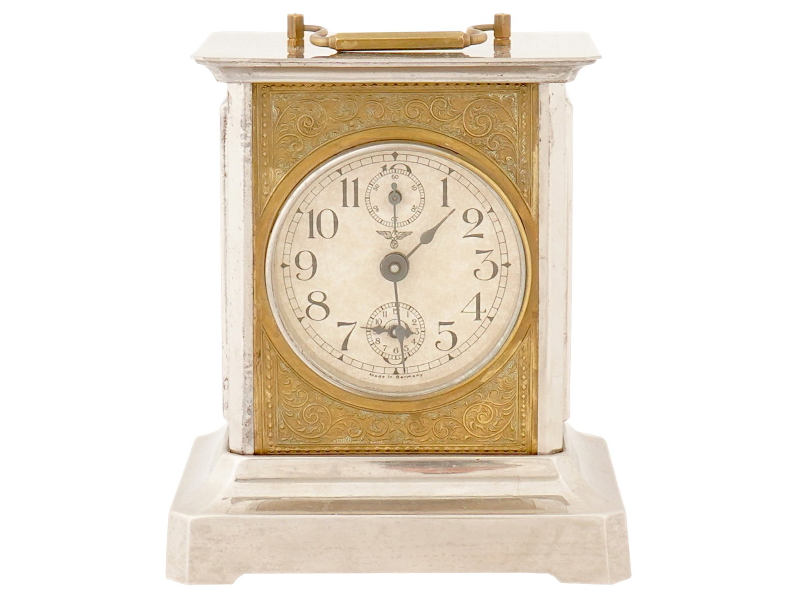 NAZI GERMAN CARRIAGE ALARM CLOCK: A mid-20th century German carriage clock with key-wind mechanism. Footed rectangular case with a top handle. Embossed brass front and back sides. Round dial with Arabic numerals and two sub-dials, Rei