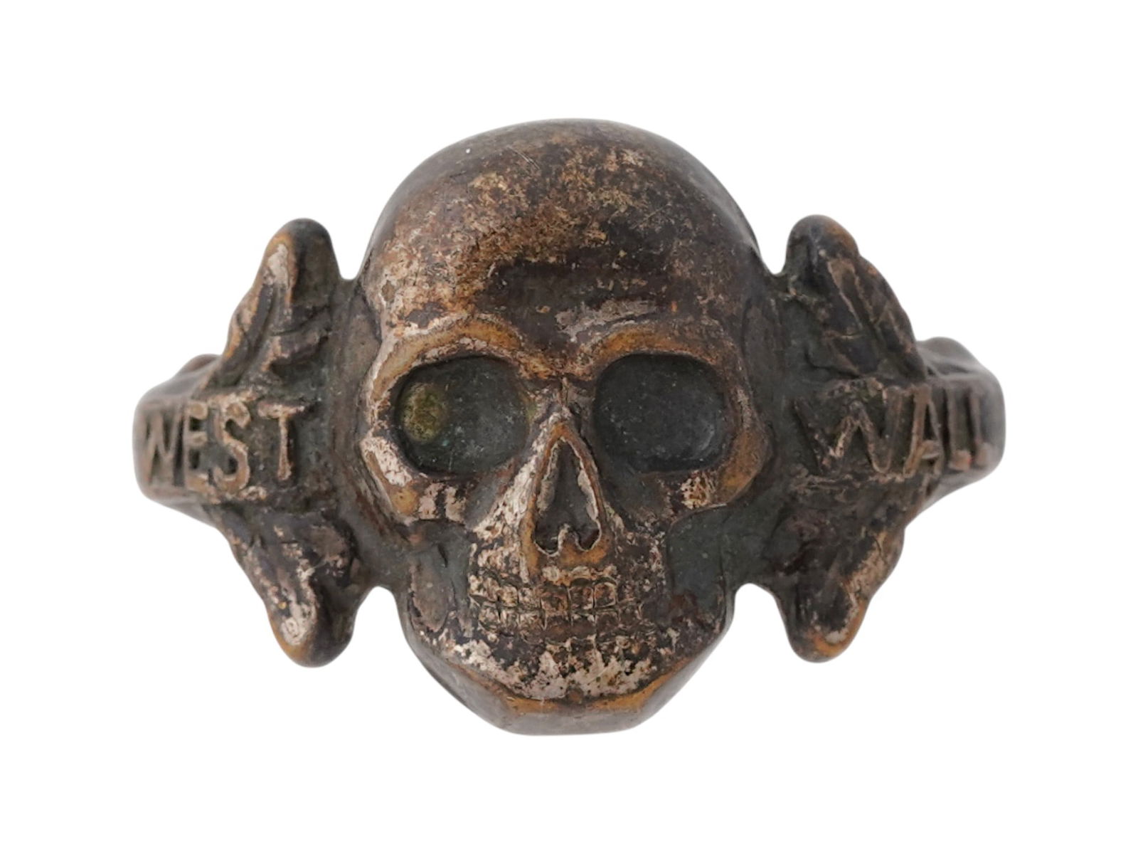WWII GERMAN SS DIVISION WEST WALL TOTENKOPF RING: A WWII Nazi German Third Reich type Waffen SS Division West Wall Totenkopf ring. The ring features a relief image of a Totenkopf skull in the center, oak leaf ornaments, and the inscription West Wall,