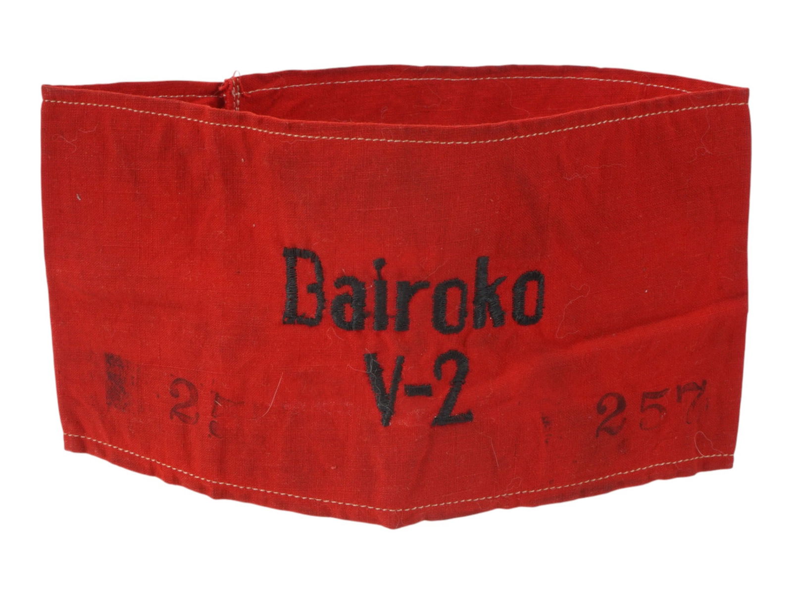 GERMAN WWII TYPE V 2 FACTORY EMPLOYEES ARMBAND: A WWII type Nazi German V2 Factory Employees armband. Made of red fabric and adorned with an embroidered inscription, Bairoko V 2. Stamped, 257, on the sides. Second World War Historical Collectibles
