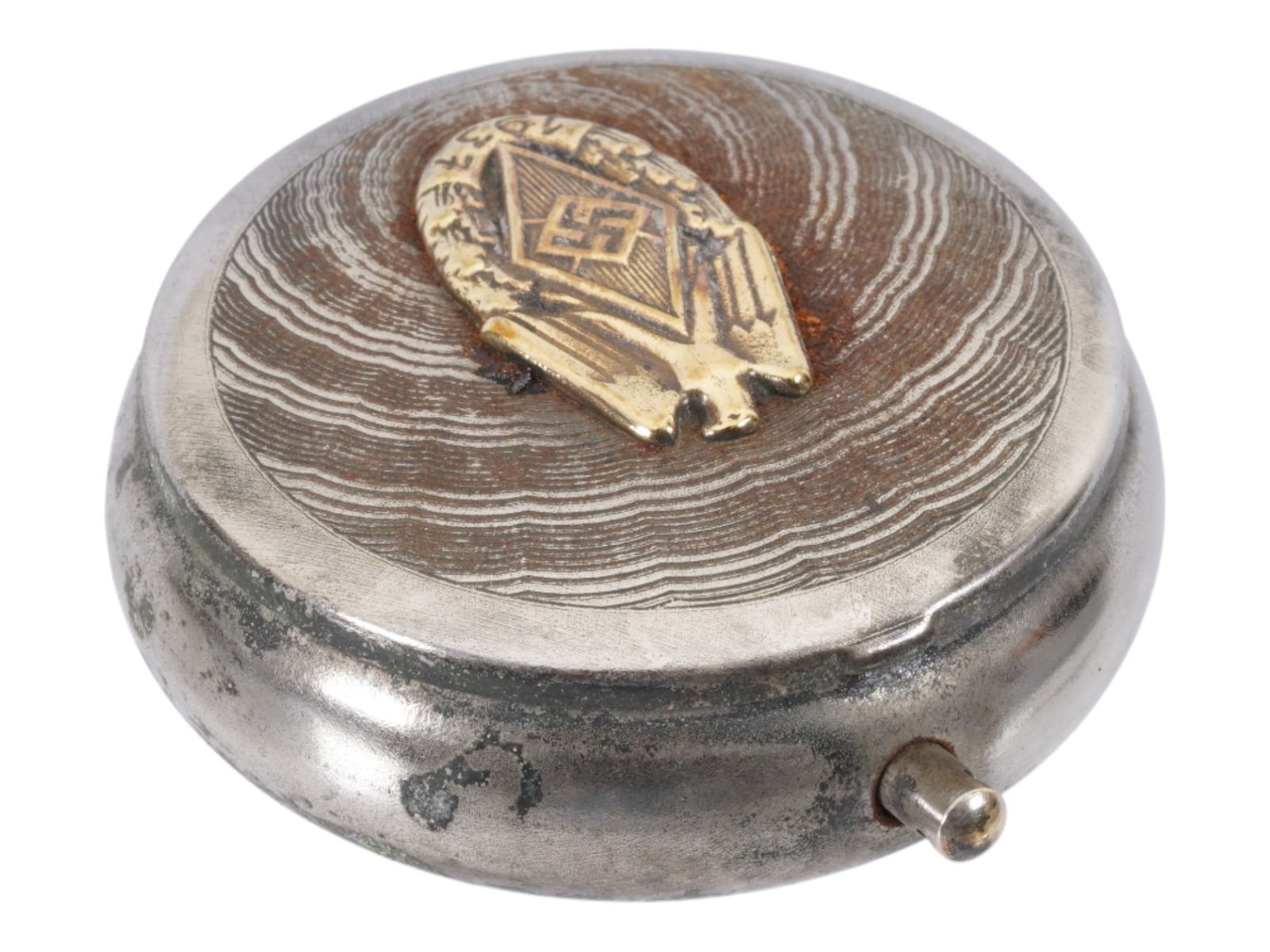 NAZI GERMAN MODEL HITLER YOUTH POCKET ASHTRAY: A Nazi German type stainless steel pocket ashtray with hinged lid. The lid is decorated with gilt overlay logo of the Hitlerjugend with date 1937. There is a cigarette holder inside. Marked RZM on the