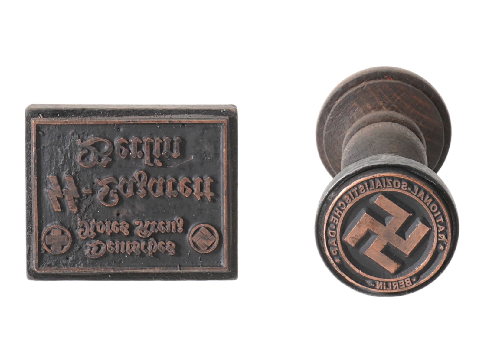 TWO WWII TYPE GERMAN WOOD AND METAL HAND STAMPS: A group of two WWII type Nazi German wood and metal ink hand stamps including a stamp for the National Sozialistische DAP, Berlin and a stamp for the Deutsches Rotes Kreuz, Lazarett Berlin. Second Wor