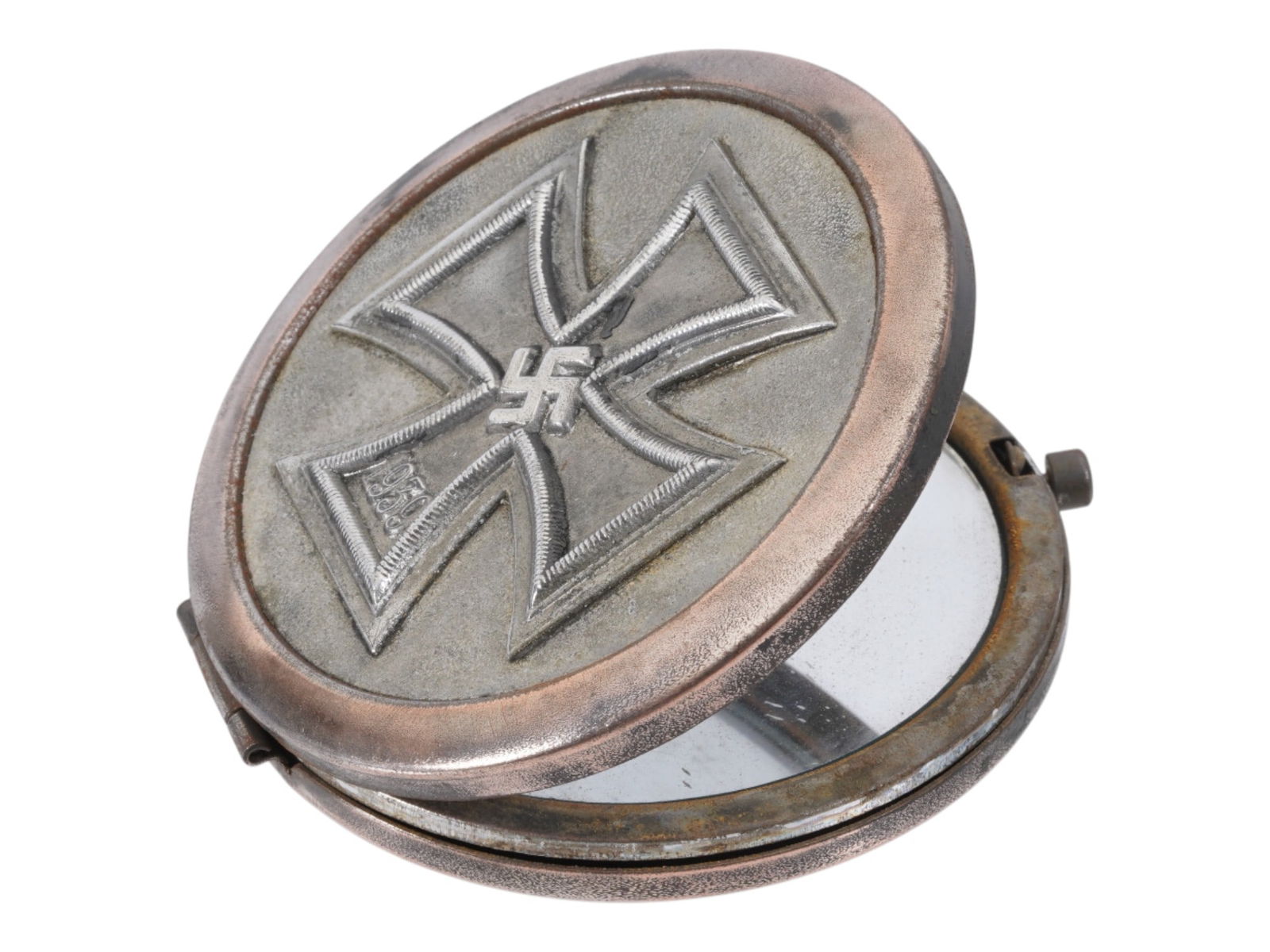 WWII TYPE GERMAN IRON CROSS COMPACT MIRROR: A WWII type German compact mirror. The lid features a raised relief emblem of the German Iron Cross, dated 1939, which incorporates a central swastika. WWII German Third Reich Nazi Military Rings, Jew