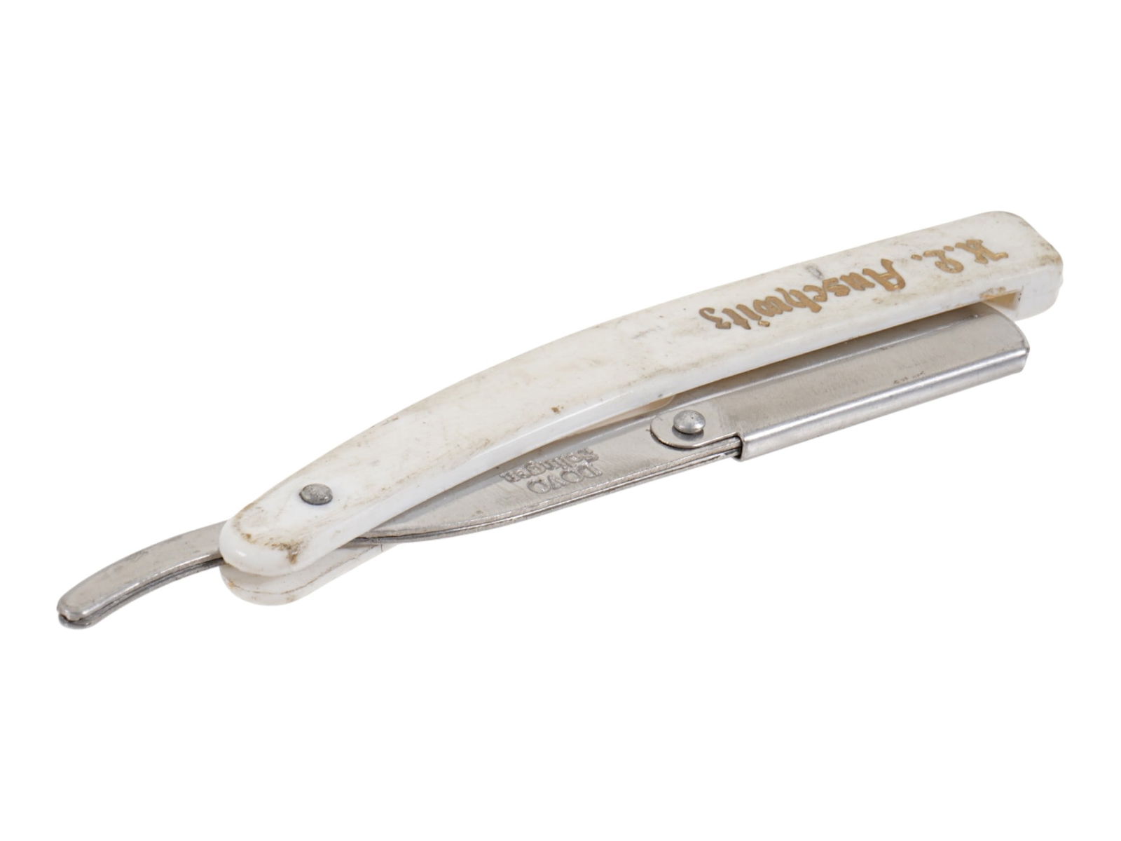 GERMAN WWII TYPE SS CONCENTRATION CAMP SHAVING RAZOR: A WWII model Nazi German Third Reich Waffen SS concentration camp straight shaving razor. The handle is adorned with an etched inscription, Auschwitz. Marked, Solingen, on a ricasso. Second World War