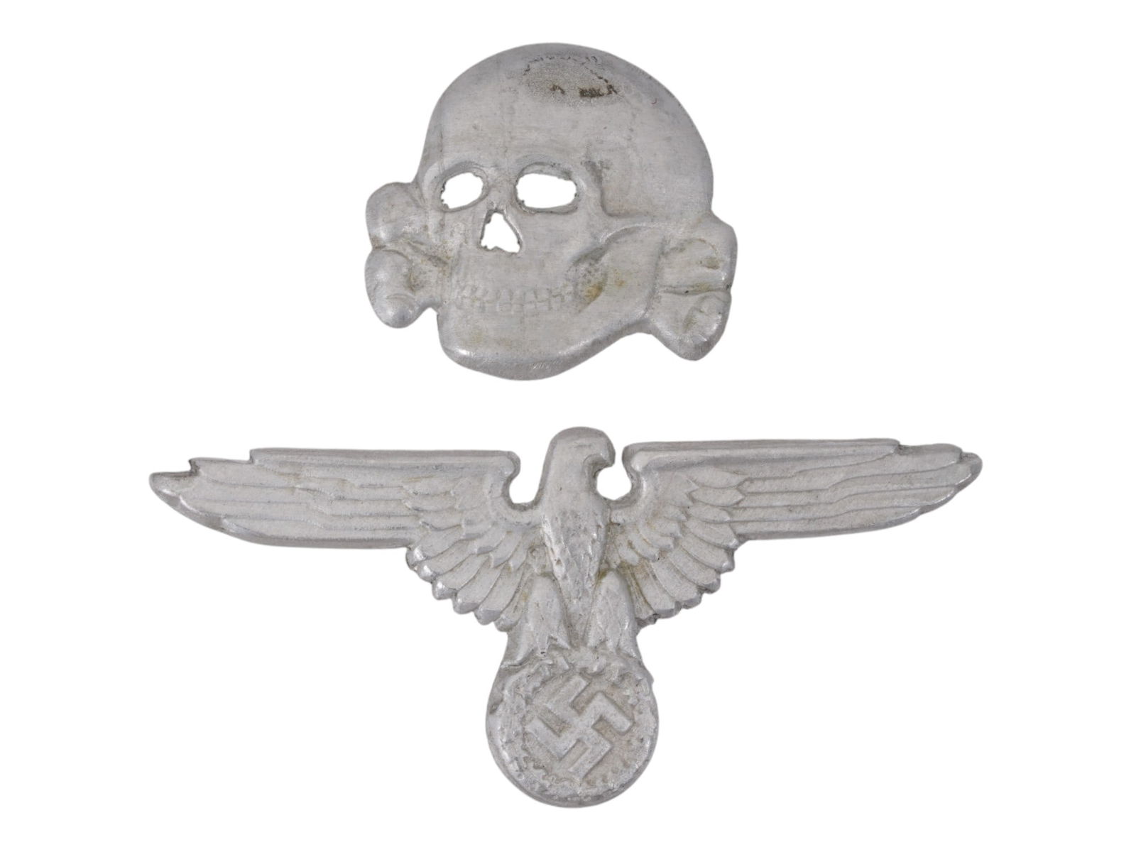 WWII MODEL NAZI GERMAN SS VISOR HAT BADGES: A pair of World War II type Nazi German Waffen SS aluminum hat badges for a visor hat. Totenkopf and Reichsadler with swastika pins. Unmarked. Second World War Historical Collectibles And Memorabilia,