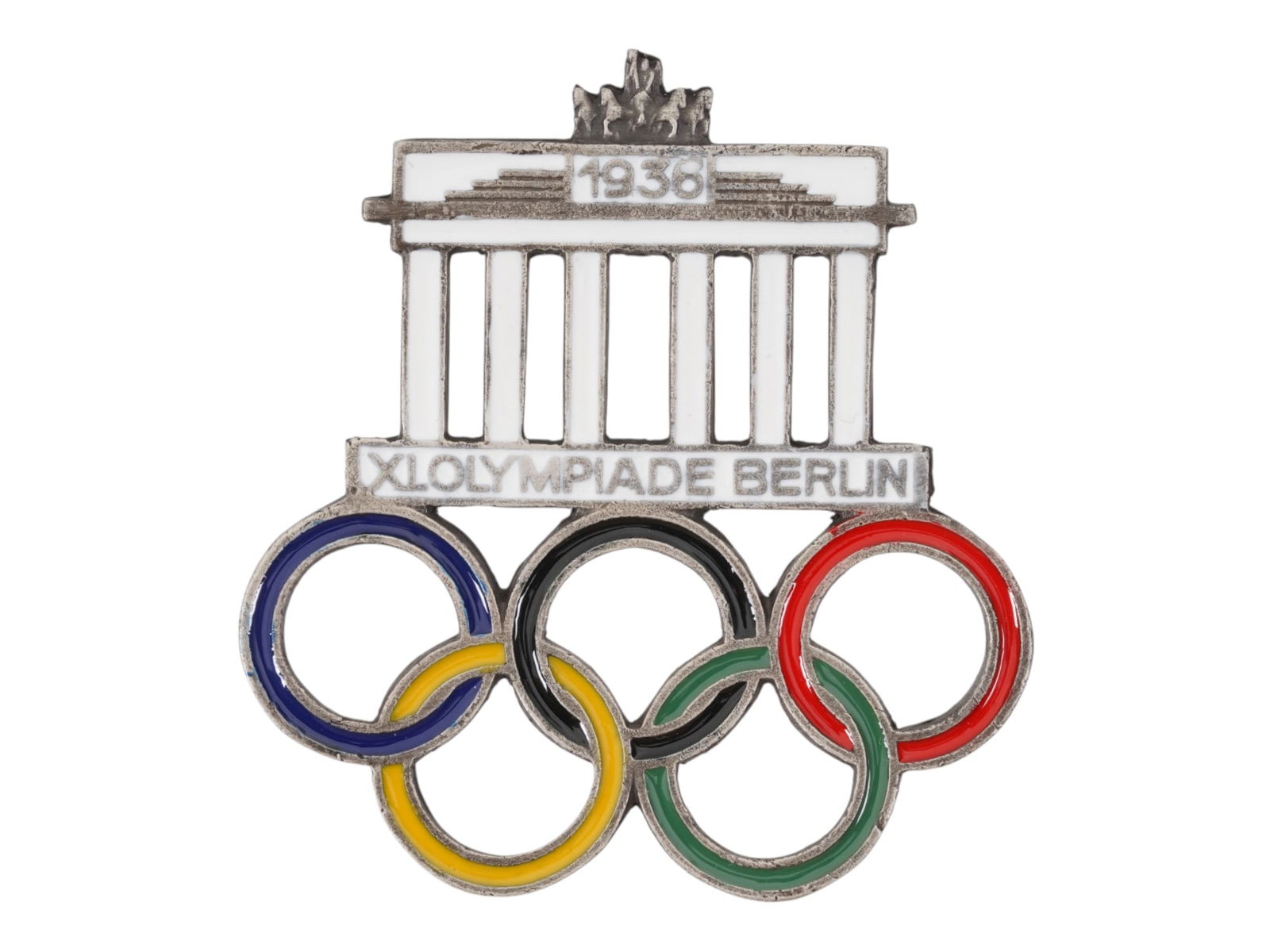 WWII TYPE 1936 OLYMPIC GAMES IN BERLIN CAR PLAQUE: A pre WWII type 1936 Summer Olympic Games in Berlin car plaque Auto Plakette. The item is polychrome enameled car plaque, Brandenburg Gate with Olympic Rings and inscription XI. Olympiade Berlin 1936.