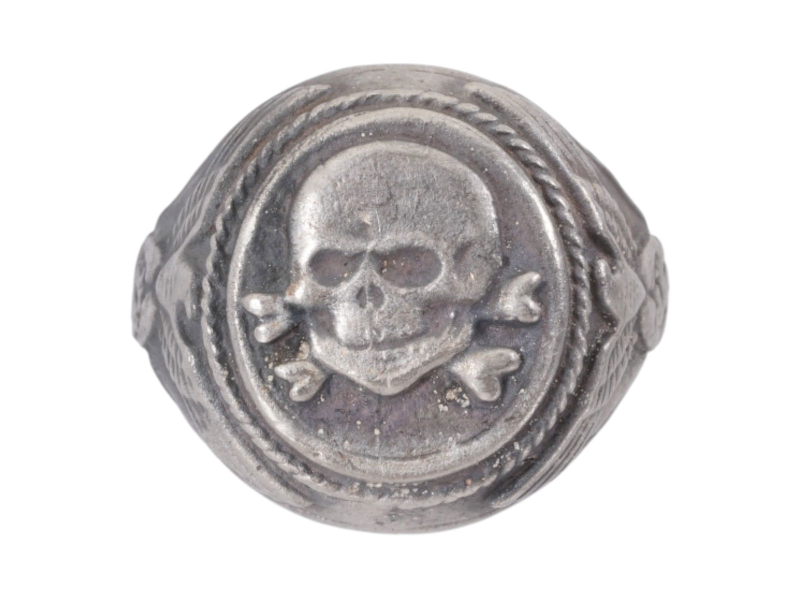GERMAN WWII MODEL WAFFEN SS TOTENKOPF SILVER RING: A WWII model Nazi German Third Reich type Waffen SS Totenkopf Silver signet ring. The exterior of the ring is engraved with eagle swastika insignia patterns on the sides and a Totenkopf skull swastika
