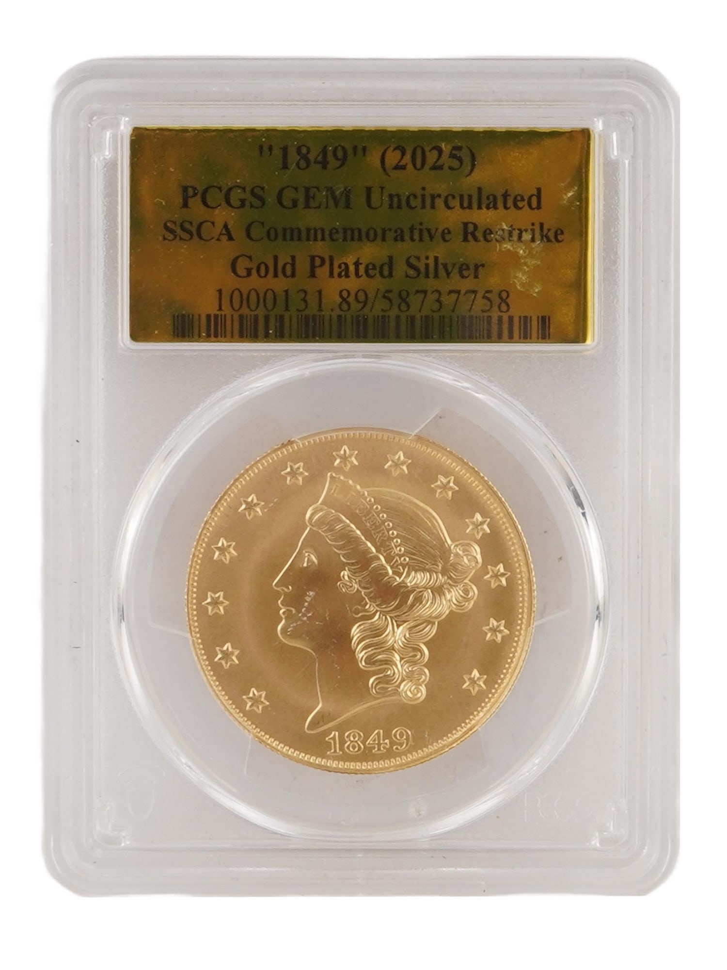 GRADED US UNCIRCULATED SSCA GOLD PLATED SILVER COIN: An American, 2025, 1849 Gem Uncirculated SSCA Commemorative Restrike gold plated silver coin, graded by PCGS. Encapsulated in a PCGS slab. The design features the historic Type I Liberty Head on the o