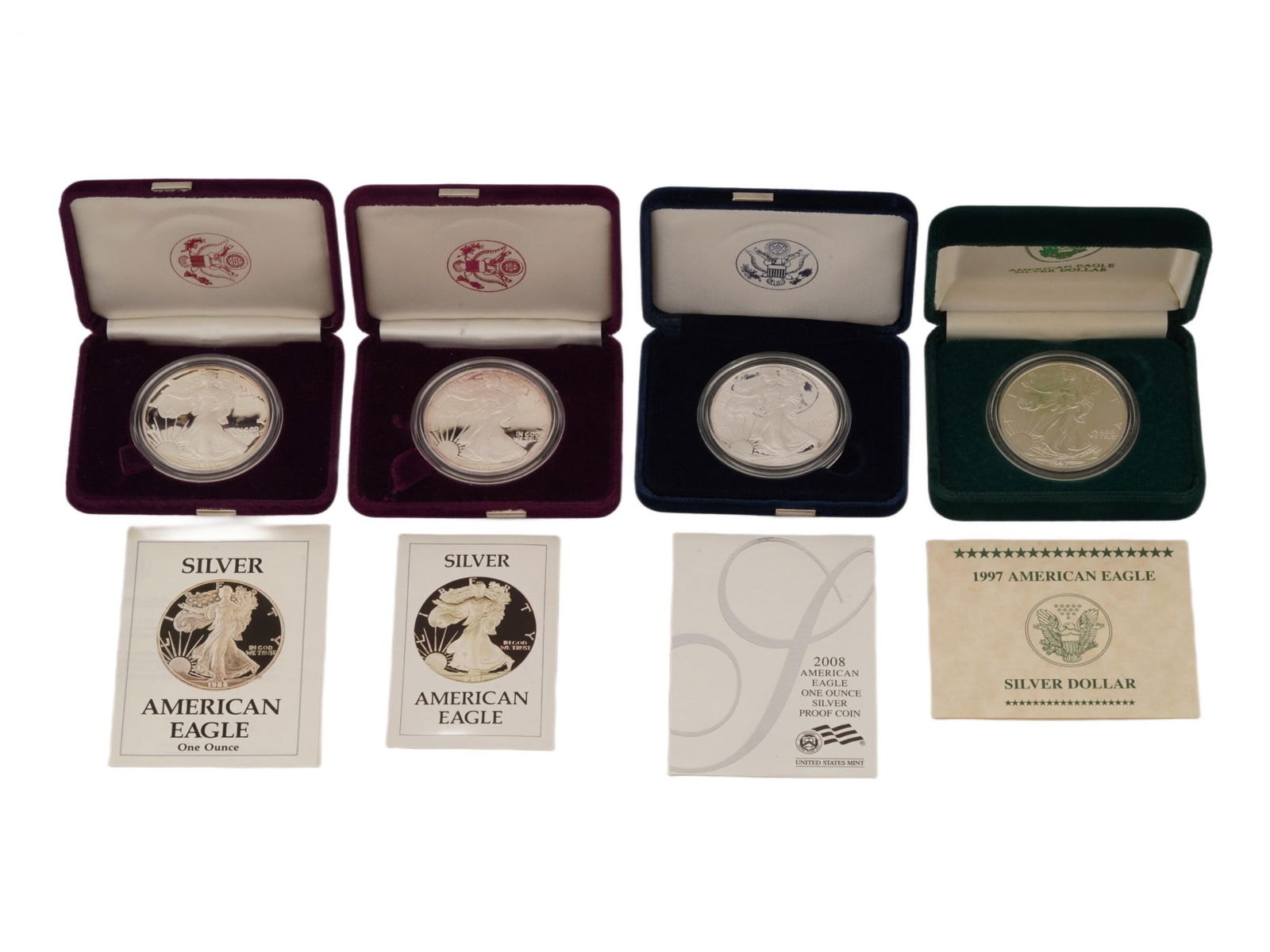 FOUR VINTAGE AMERICAN EAGLE SILVER DOLLAR COINS (1 of 9)