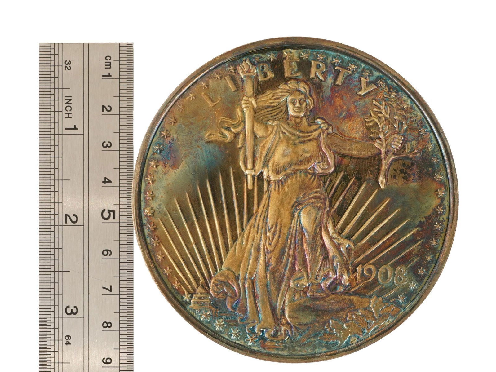 AMERICAN ST GAUDENS DOUBLE EAGLE SILVER LARGE SCALE COIN: An unusually large size (89 mm) American Saint-Gaudens double eagle silver coin, 1908. The Saint-Gaudens double eagle is a twenty-dollar coin, or double eagle, produced by the United States Mint from