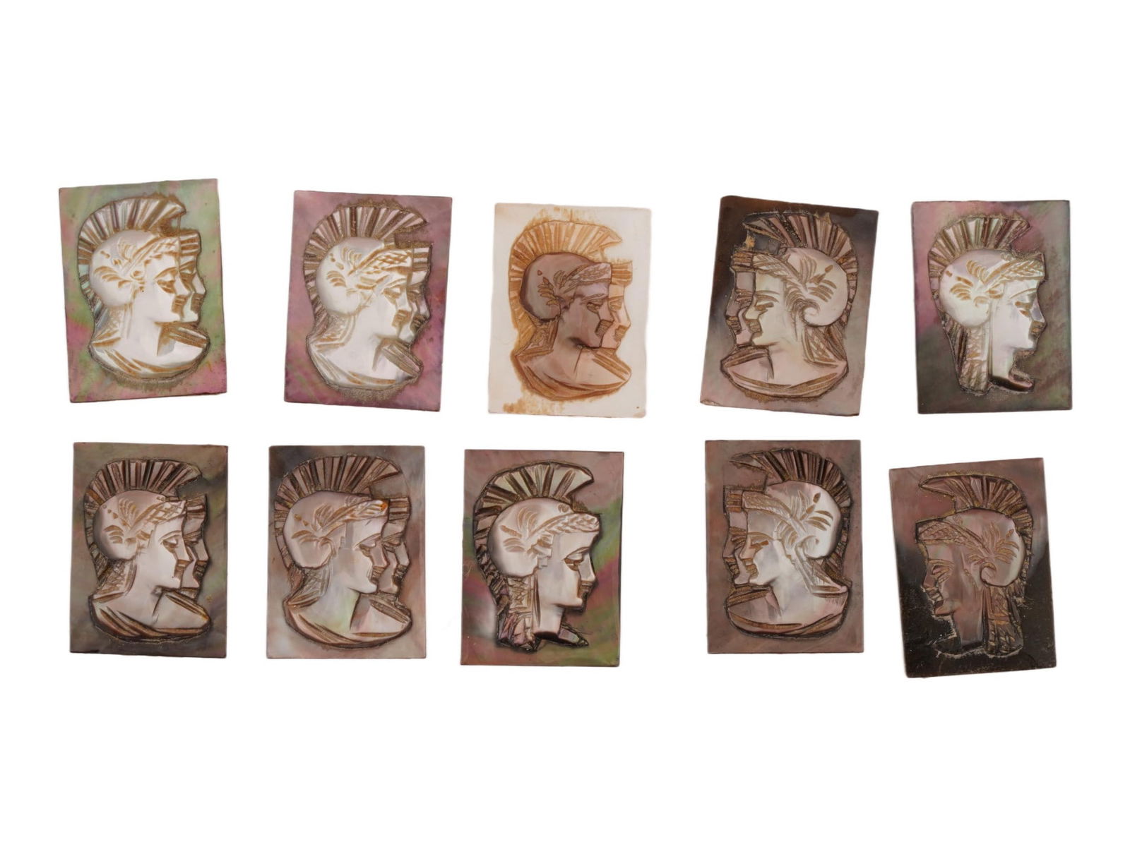 COLLECTION OF ROMAN PORTRAIT CARVED SHELL CAMEOS: A collection of hand carved conch shell cameos. A total of 10 items. Each piece features a Roman soldier profile rendered in high relief. Rectangular shape. Collectible Jewelry And Glyptic Art, Sculpt