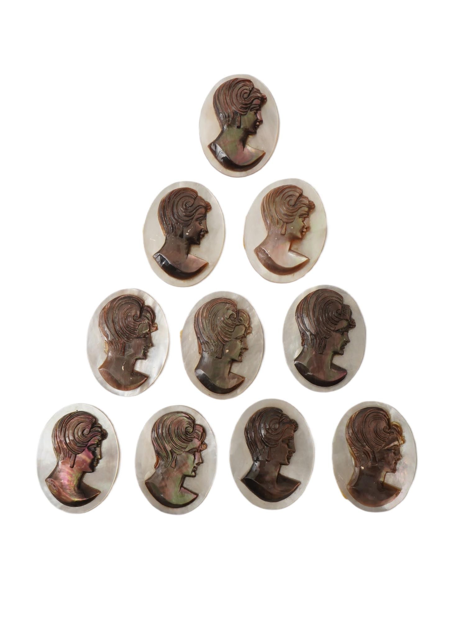COLLECTION OF FEMALE PORTRAIT CARVED SHELL CAMEOS: A collection of hand carved conch chell cameos. A total of 10 items. Each piece is crafted from conch shell, featuring female profile portraits rendered in high relief. Oval shape. Collectible Jewelry