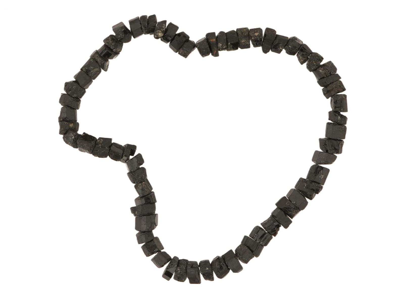 VINTAGE HAND CARVED STONE BEAD STRING: A vintage hand carved stone bead string. Large, irregularly shaped beads of black color with light inclusions. Vintage Carved Stone Jewelry and Accessories For Collectors. THIS LOT IS ELIGIBLE