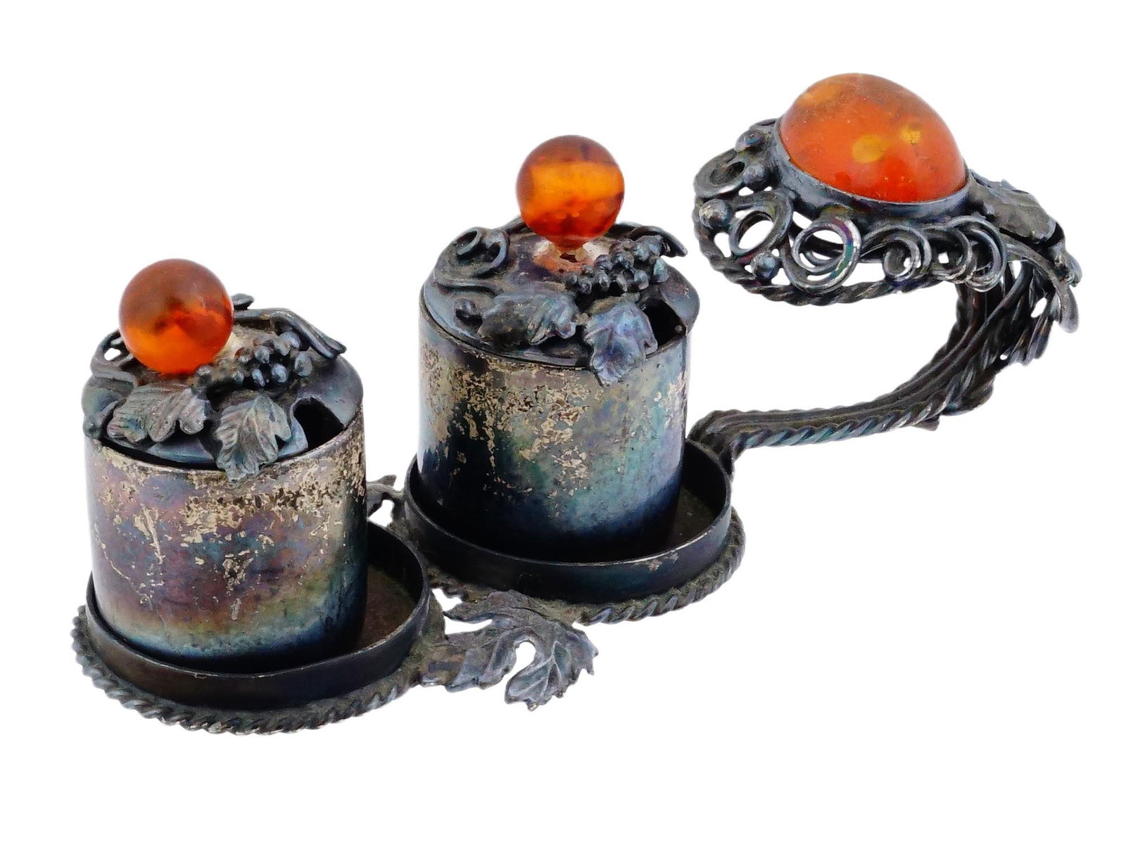 ANTIQUE STERLING SILVER DOUBLE SALT CELLAR VINES MOTIF: An antique sterling silver double salt cellar. It is designed as a carrier with a handle, holding two removable cylindrical containers. The decoration is detailed with motifs of grape leaves and vines