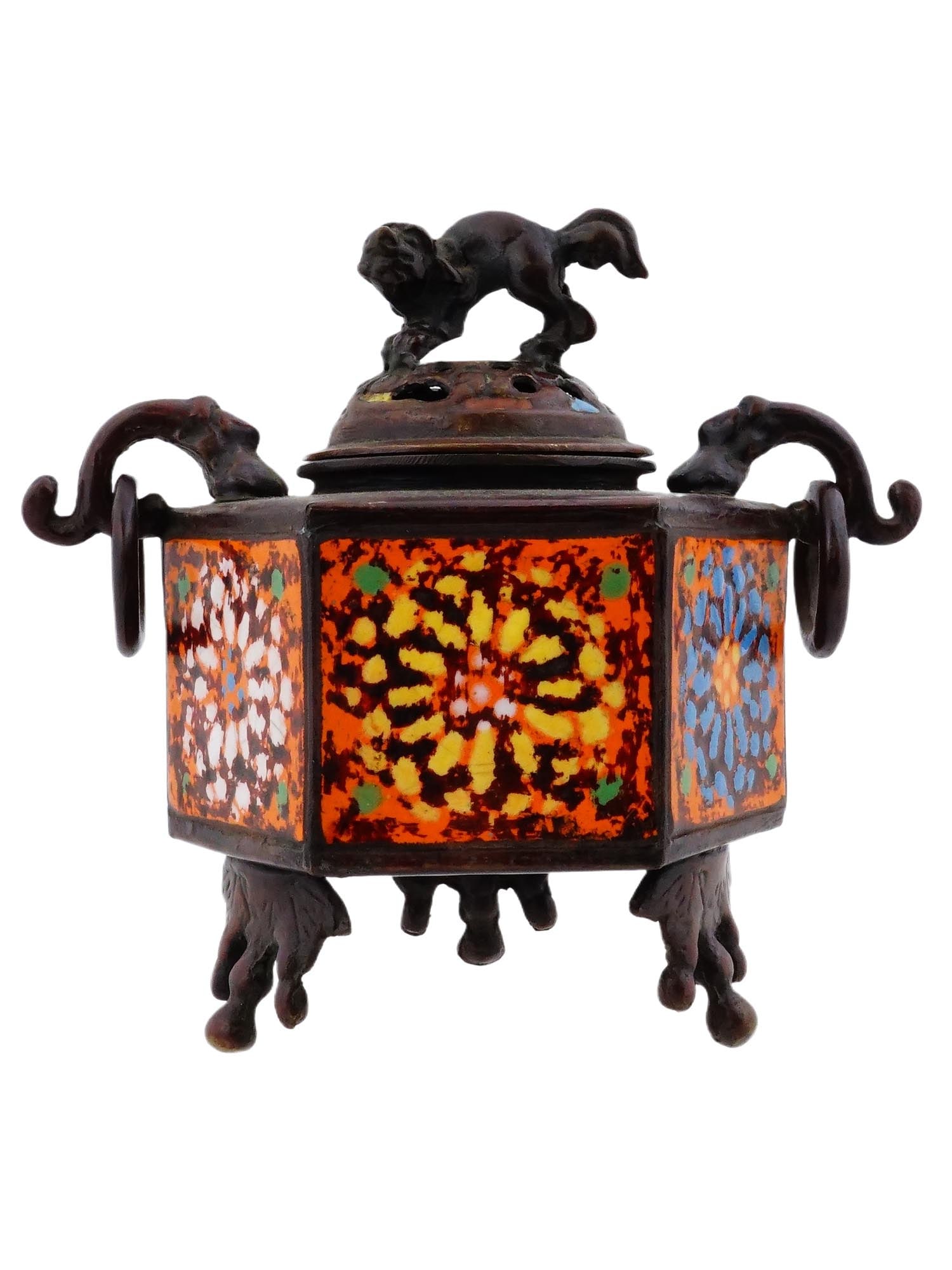 CHINESE QING BRONZE HEXAGONAL INCENSE BURNER: A Chinese bronze hexagonal incense burner. The piece is adorned with colorful panels with abstract design in orange, yellow, blue, white, and green patterns. The pierced lid is topped with a detailed,