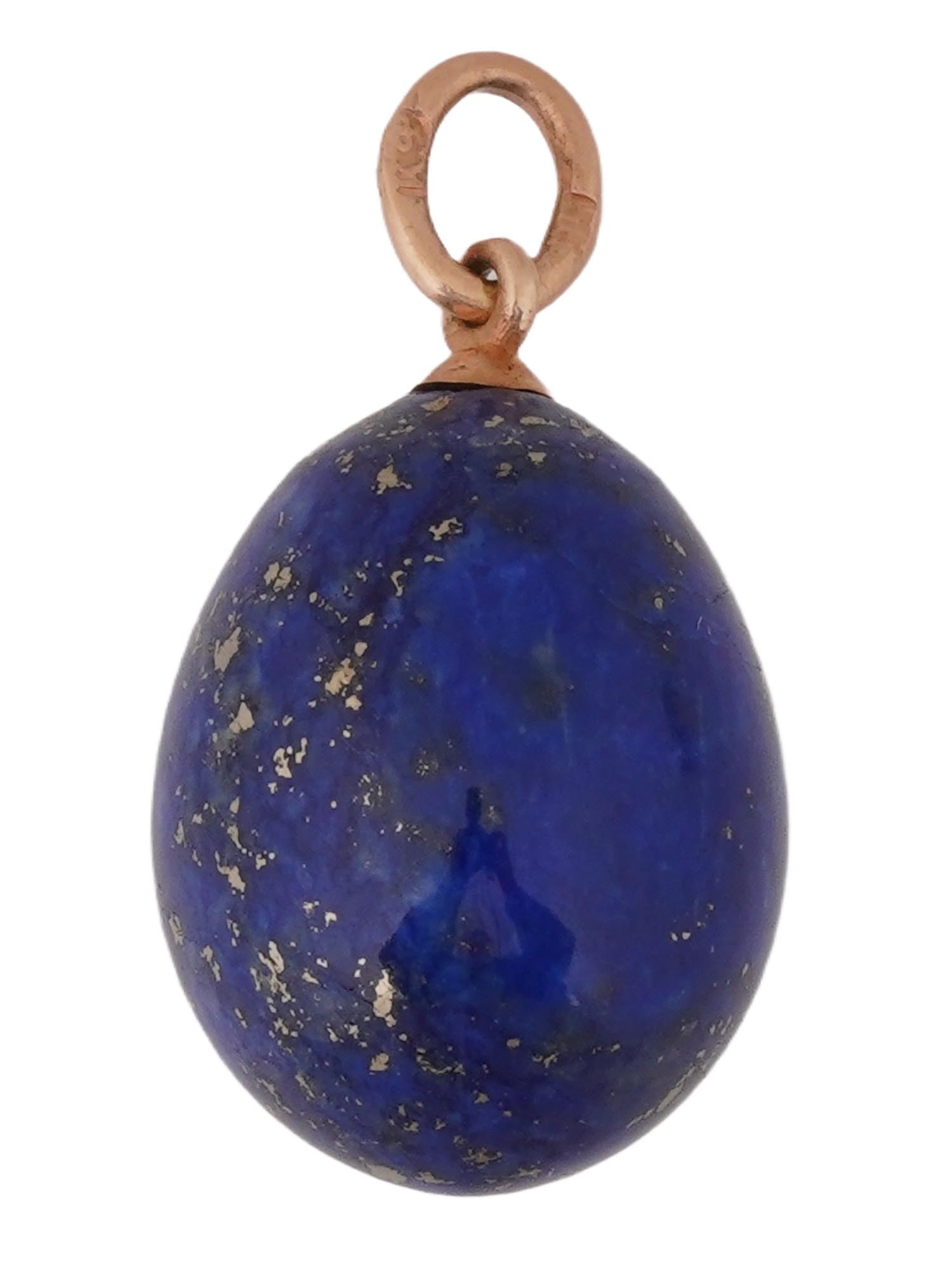 RUSSIAN 14K GOLD CARVED LAPIS LAZULI EASTER EGG PENDANT: A Russian 14K Gold and hand carved Lapis Lazuli Easter egg pendant. Marked with 56k a Russian Gold standard hallmark, and a makers mark, on a suspension ring. Russian Gold and Silver, Carved Stone Pen