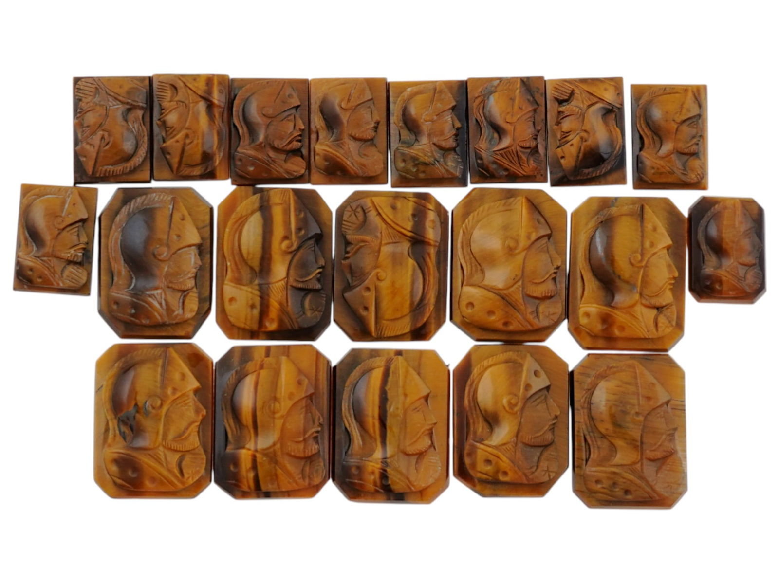 COLLECTION OF 20 VARIOUS ANTIQUE HAND CARVED CAMEOS: A collection of 20 antique hand carved cameos, dating to the late 19th to early 20th century. Each piece features knights in armor rendered in high relief. The cameos are presented in a variety of ova